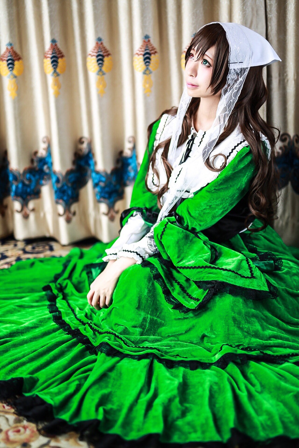 blurry blurry_background brown_hair depth_of_field dress green_dress head_scarf long_hair long_sleeves solo suiseiseki