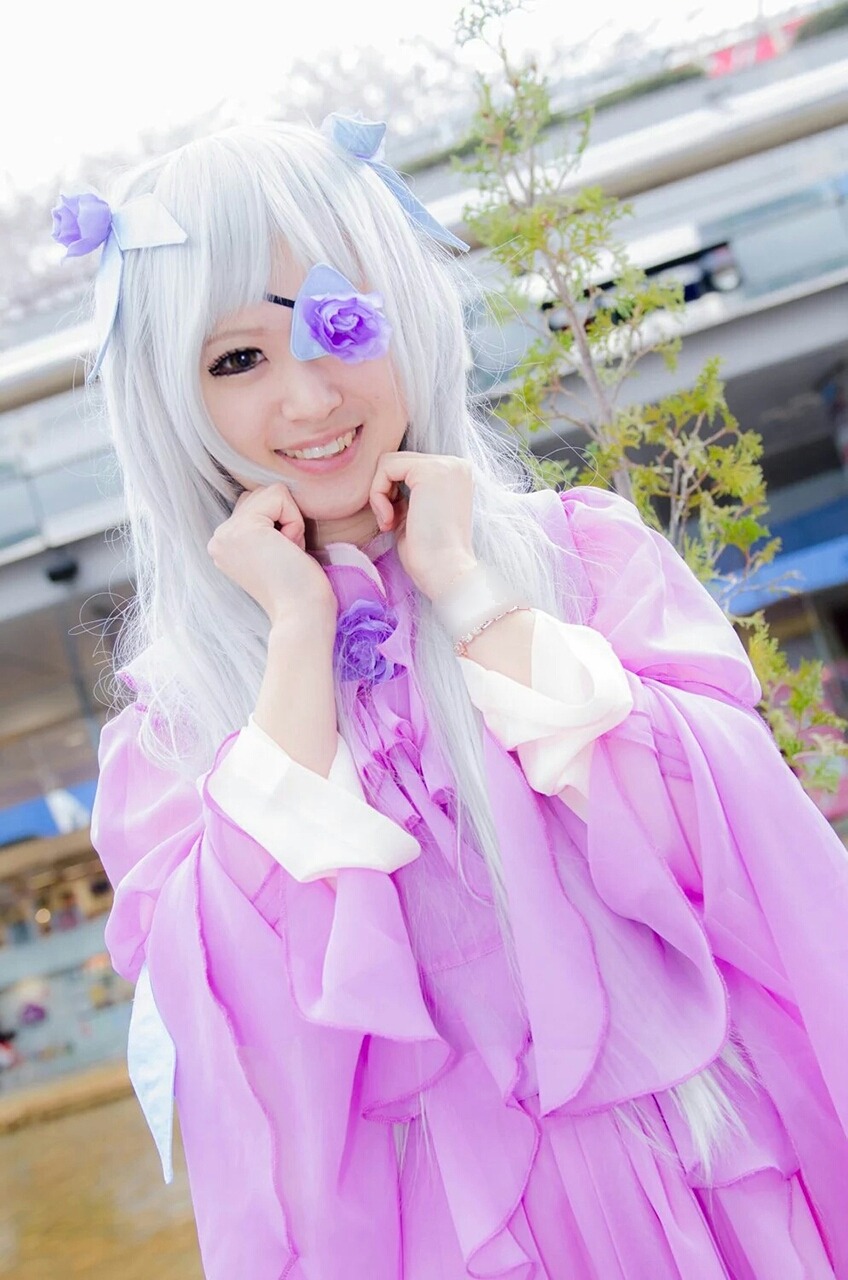 1girl bangs barasuishou blurry blurry_background depth_of_field eyepatch flower grin hair_ornament long_hair long_sleeves looking_at_viewer purple_eyes skirt smile solo teeth white_hair