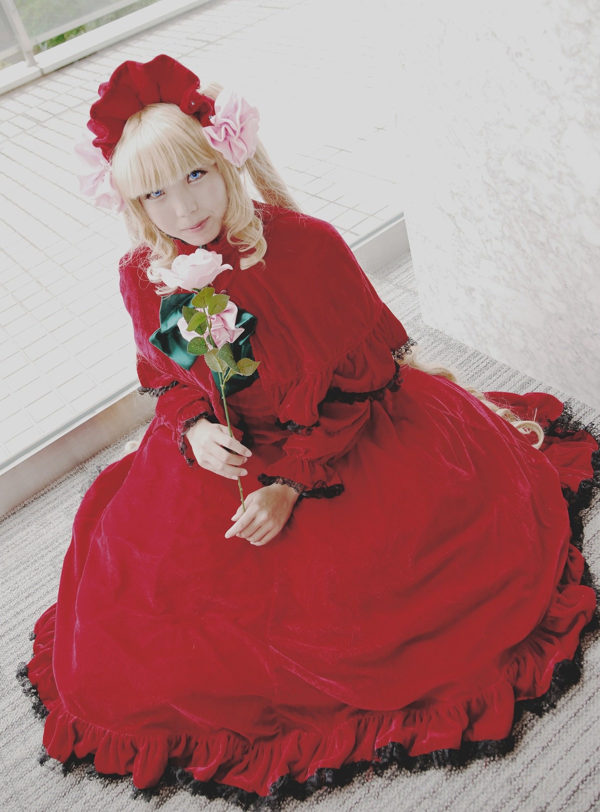 1girl blonde_hair blue_eyes bonnet bow dress flower frills lips long_sleeves looking_at_viewer red_dress rose shinku sitting smile solo