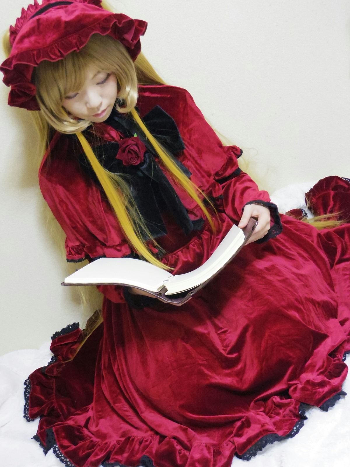 1girl blonde_hair bonnet closed_eyes dress flower frills hat long_hair long_sleeves red_dress rose shinku sitting smile solo