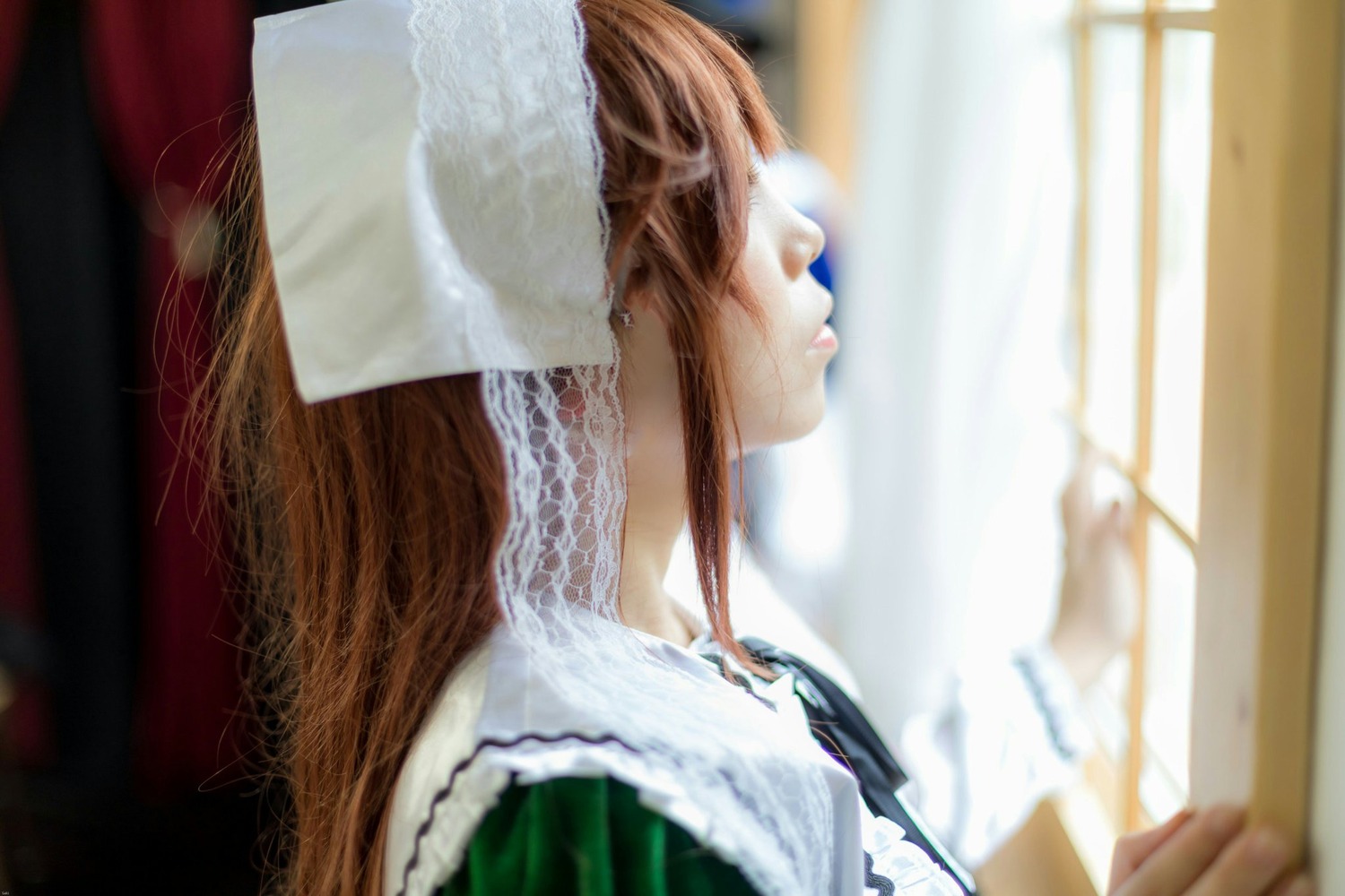 1girl blurry blurry_background blurry_foreground brown_hair closed_eyes depth_of_field dress frills indoors long_hair maid solo suiseiseki