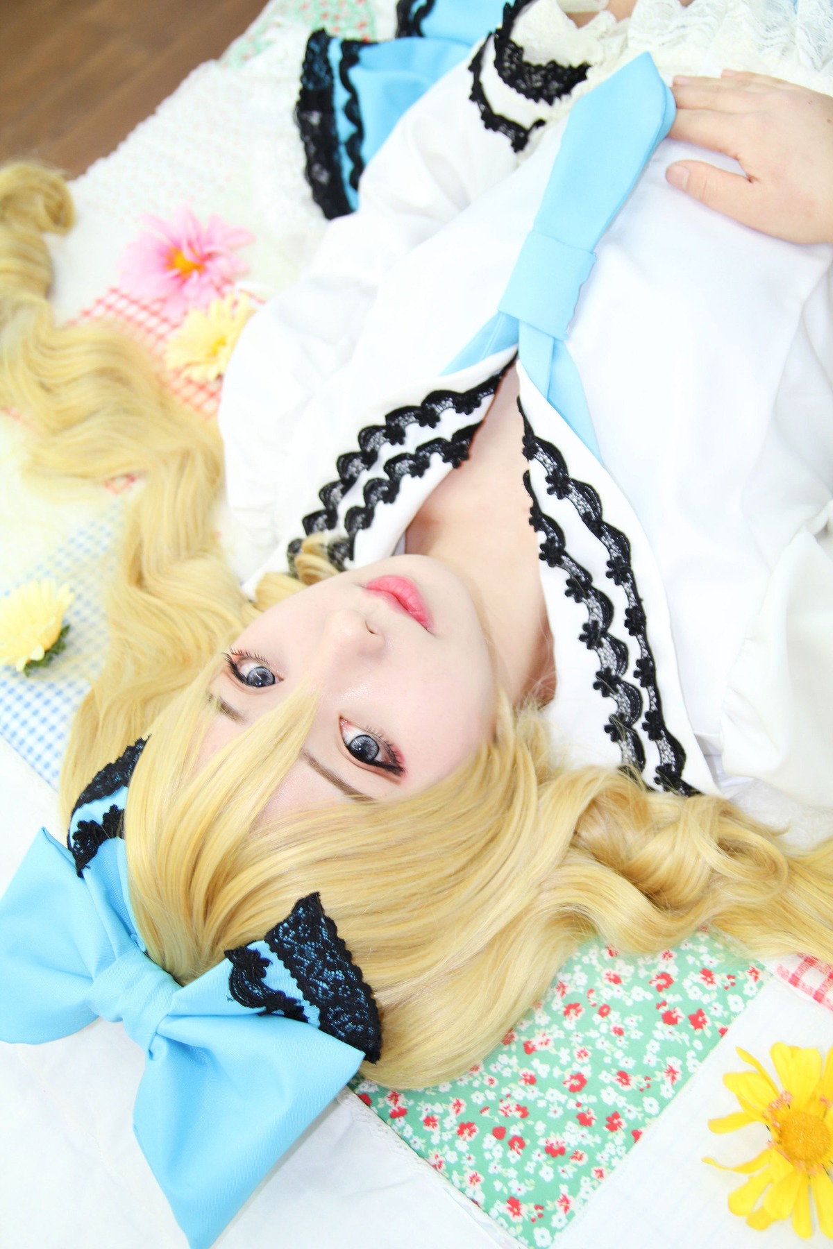 1girl blonde_hair blue_eyes bow eyelashes hair_bow lips long_hair photo shinku solo
