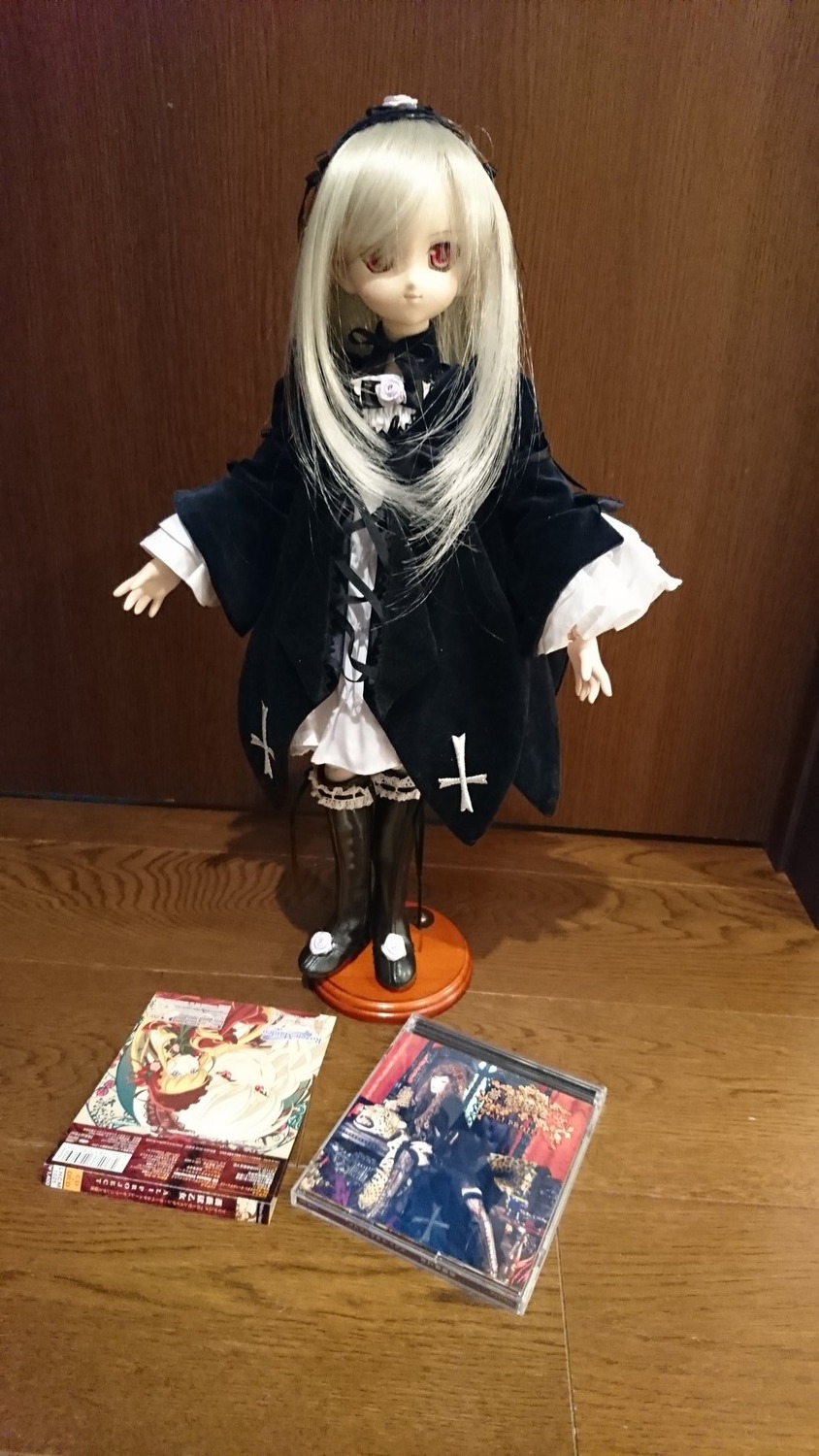 1girl black_dress blonde_hair doll dress figure long_hair photo red_eyes solo standing suigintou white_hair