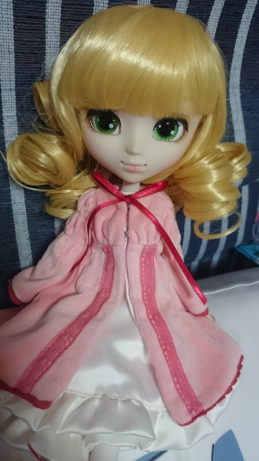 1girl blonde_hair doll dress drill_hair green_eyes hinaichigo looking_at_viewer ribbon smile solo twin_drills twintails