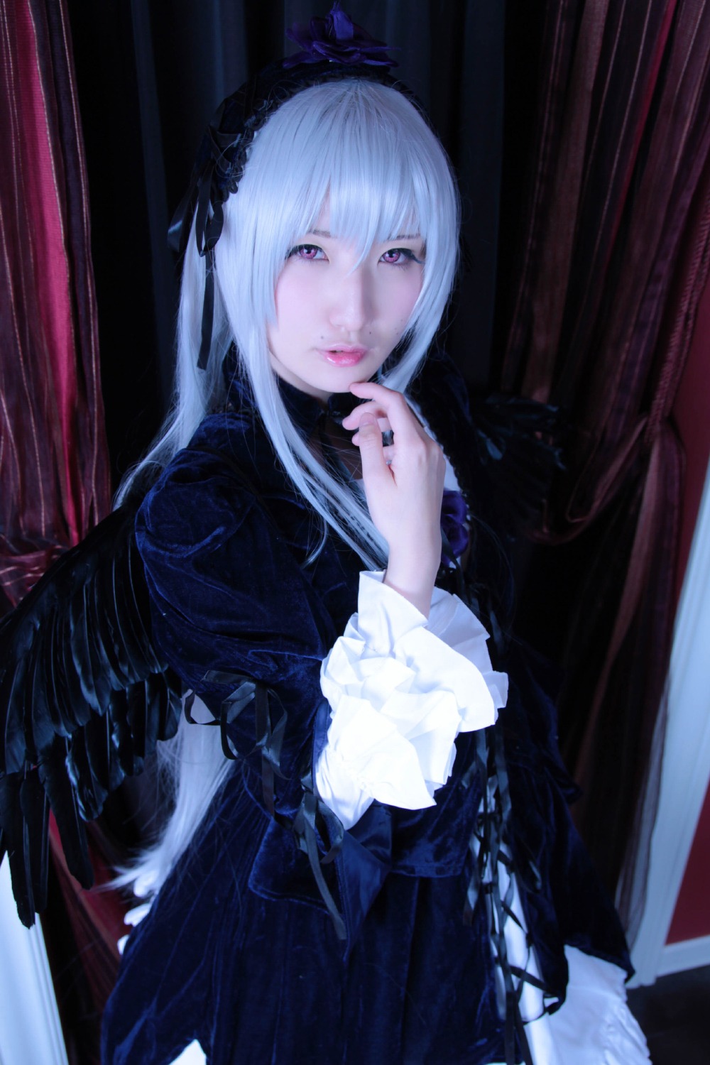 1girl black_dress black_wings dress frills gothic_lolita hairband lolita_fashion long_hair long_sleeves looking_at_viewer silver_hair solo suigintou very_long_hair wings