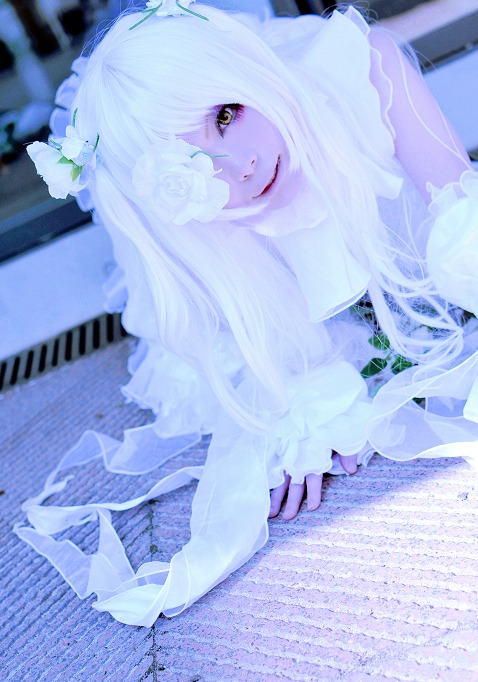 1girl blurry blurry_background depth_of_field dress flower hair_over_one_eye kirakishou lips long_hair looking_at_viewer photo solo white_dress white_hair yellow_eyes