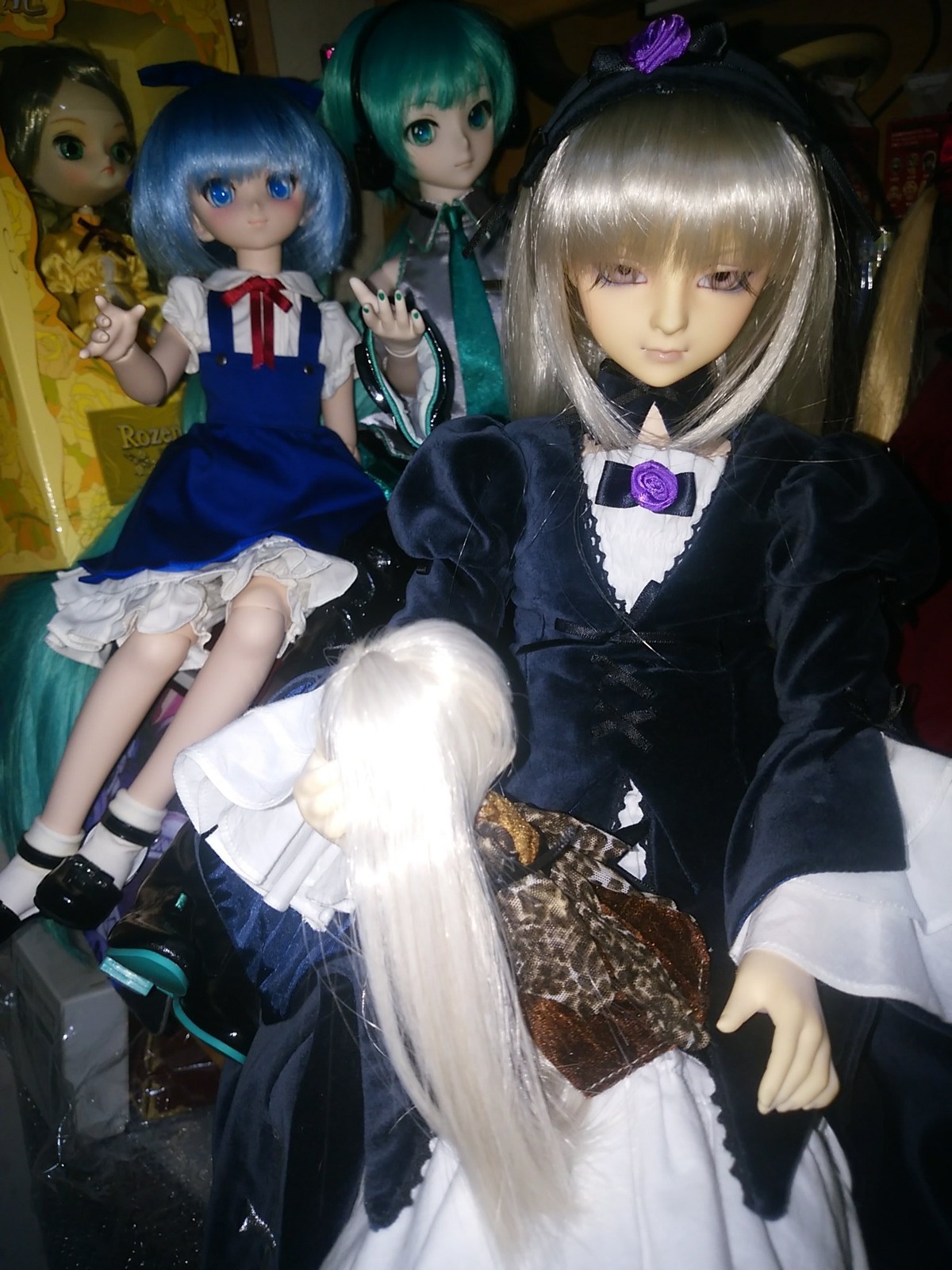 3girls bangs blonde_hair blue_eyes blue_hair bow cirno doll dress flower frills green_hair hair_bow hair_ornament hat long_hair long_sleeves looking_at_viewer multiple_girls puffy_sleeves ribbon short_hair sitting smile solo suigintou wings