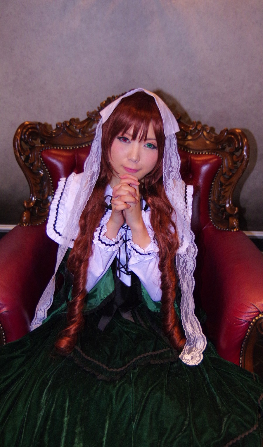 1girl blue_eyes brown_hair interlocked_fingers lips long_hair long_sleeves looking_at_viewer nail_polish sitting smile solo suiseiseki