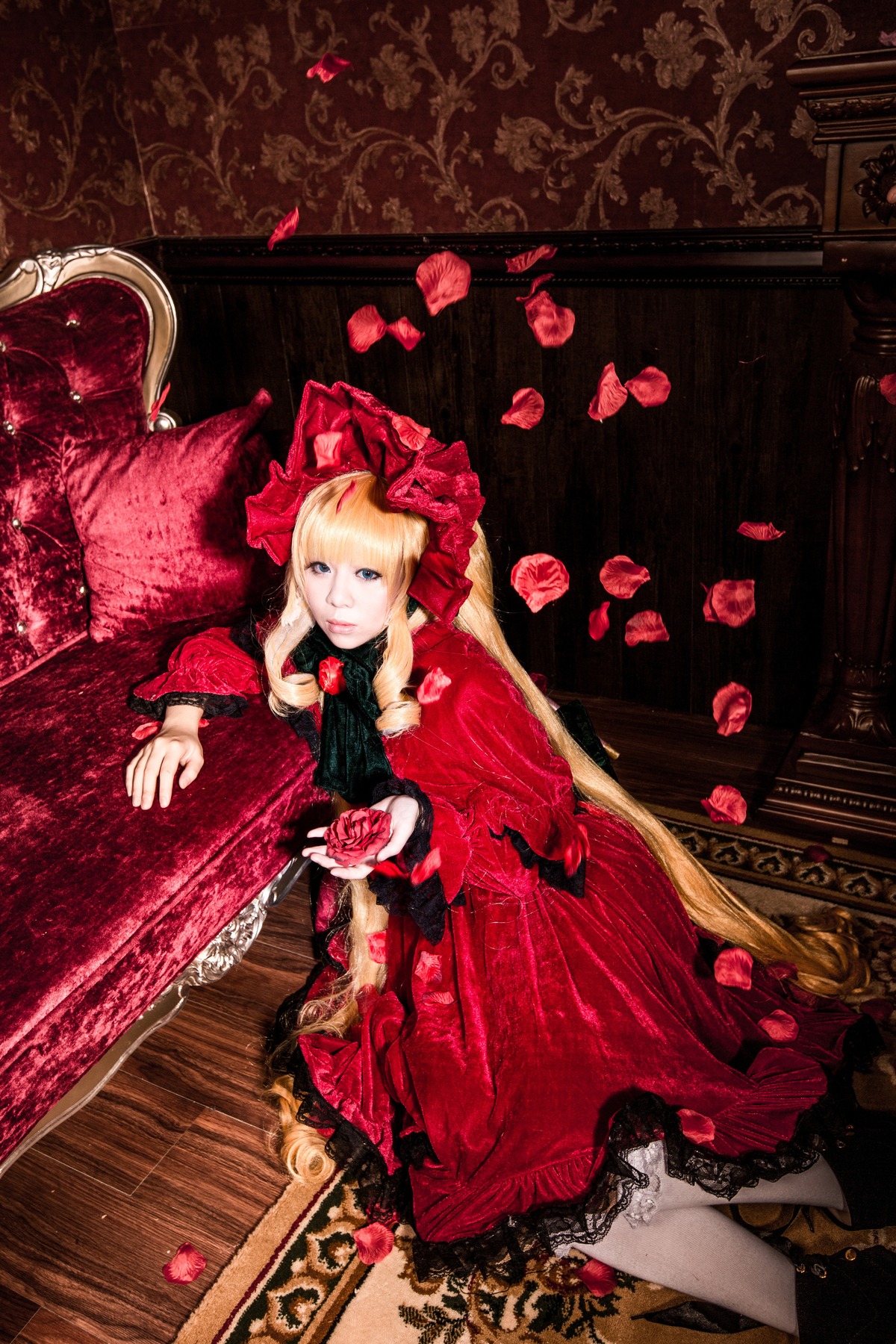 1girl blonde_hair blue_eyes bonnet curtains dress flower long_hair petals red_dress rose shinku solo