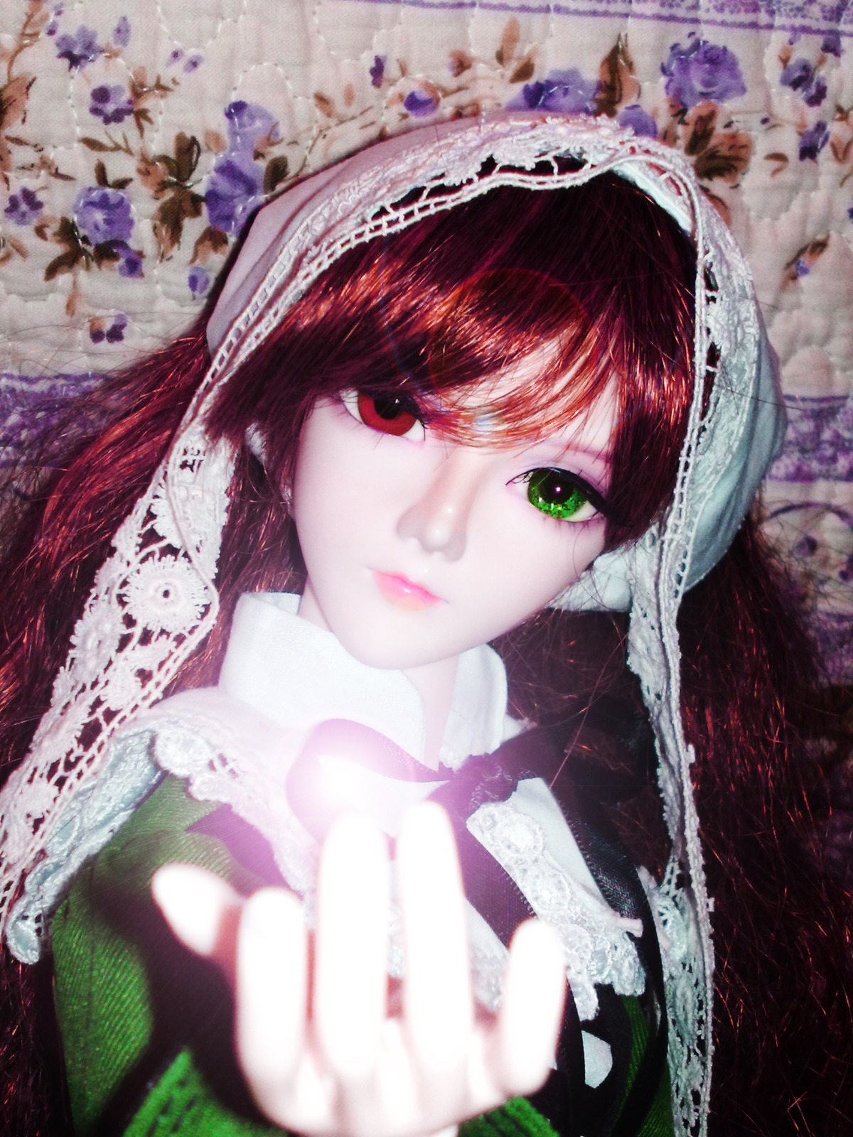 1girl bangs blurry brown_hair closed_mouth doll fingernails green_eyes hands heterochromia lips long_hair looking_at_viewer makeup red_eyes solo suiseiseki