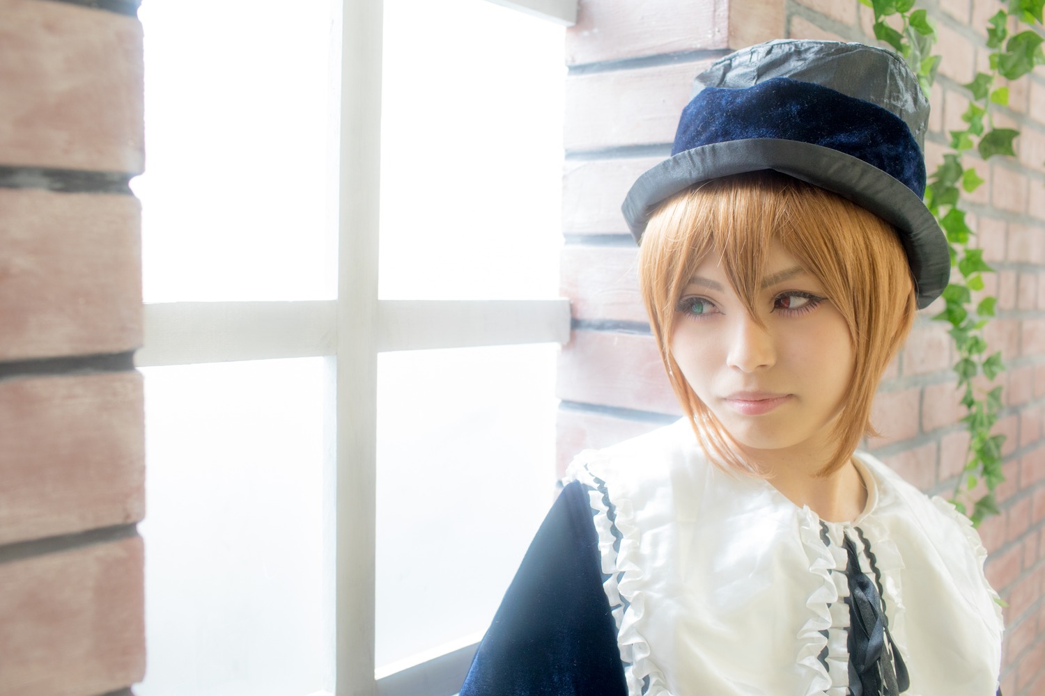 1girl blonde_hair blue_eyes blue_headwear blurry building closed_mouth depth_of_field frills hat lips looking_at_viewer outdoors realistic short_hair solo