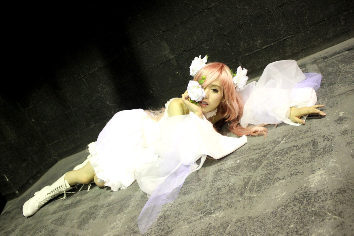 1girl boots dress flower gloves hair_flower hair_ornament high_heels kirakishou long_hair lying megurine_luka on_side pink_hair solo white_dress white_flower white_footwear white_rose