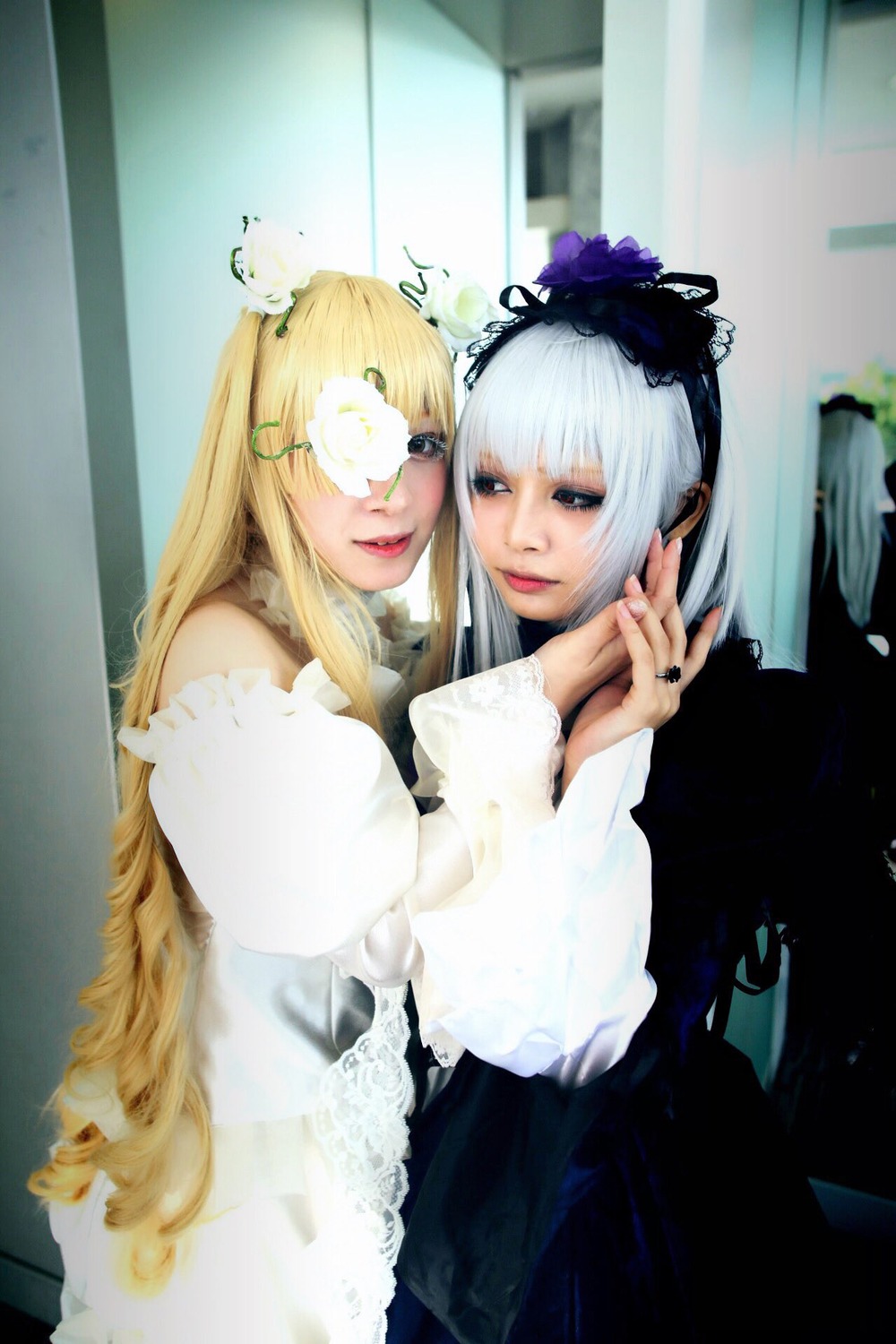 2girls bangs blonde_hair blunt_bangs dress eyepatch flower frills gothic_lolita lips lolita_fashion long_hair multiple_cosplay multiple_girls nail_polish tagme