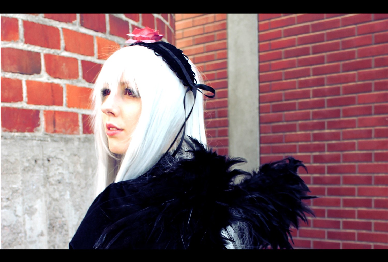 1girl black_ribbon hairband letterboxed lips looking_at_viewer profile ribbon solo suigintou