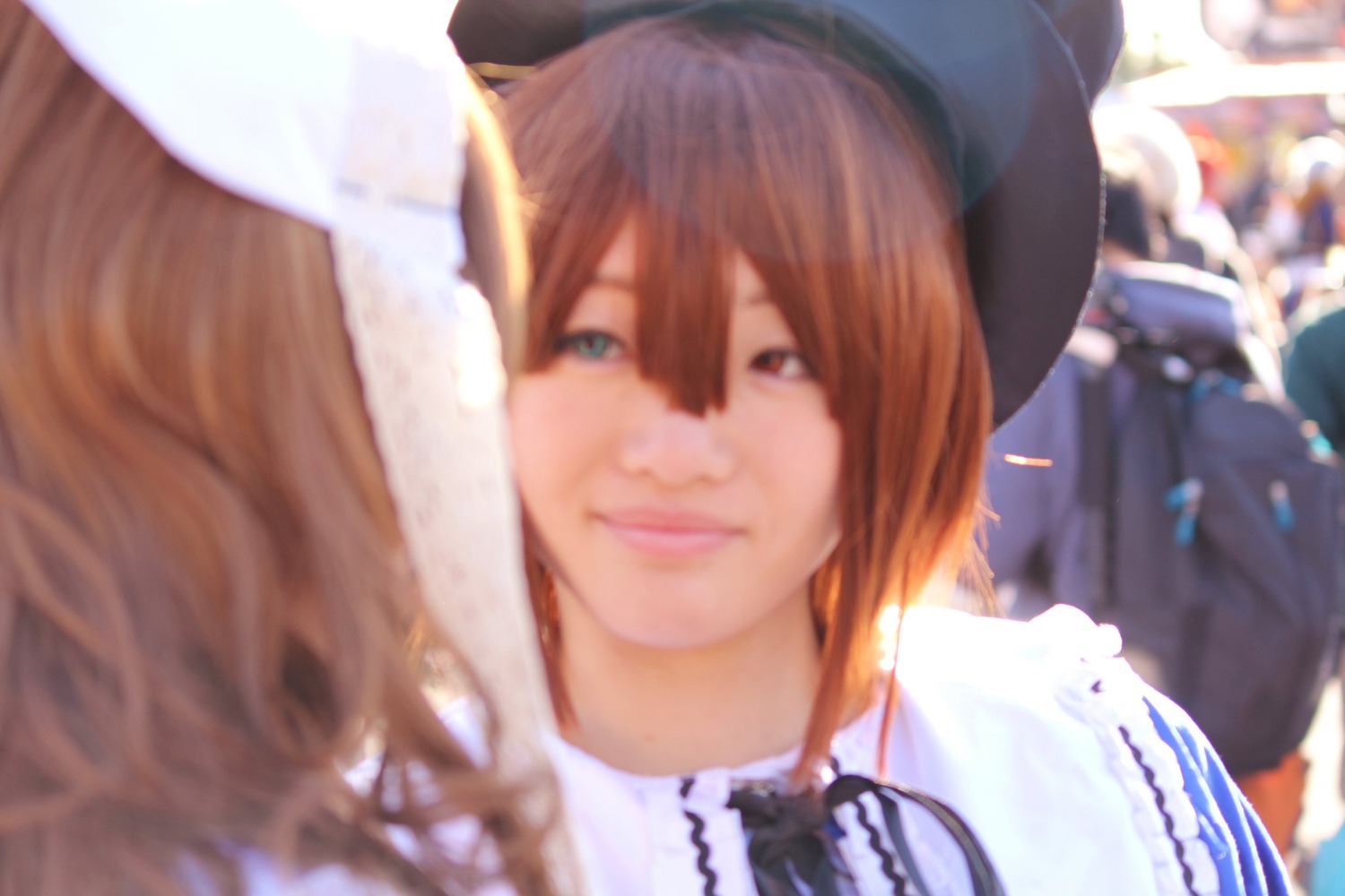 1girl bangs blue_eyes blurry blurry_background blurry_foreground brown_hair depth_of_field dress hair_between_eyes heterochromia lips long_hair looking_at_viewer multiple_cosplay smile solo tagme