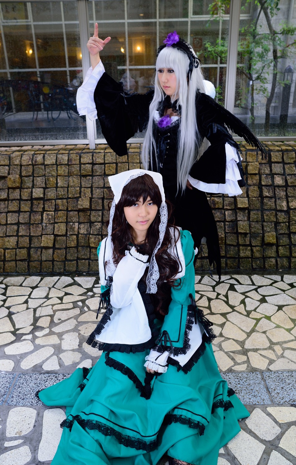 2girls black_hair blue_dress brick_wall building chain-link_fence dress fence flower frills long_hair multiple_cosplay multiple_girls smile stained_glass tagme