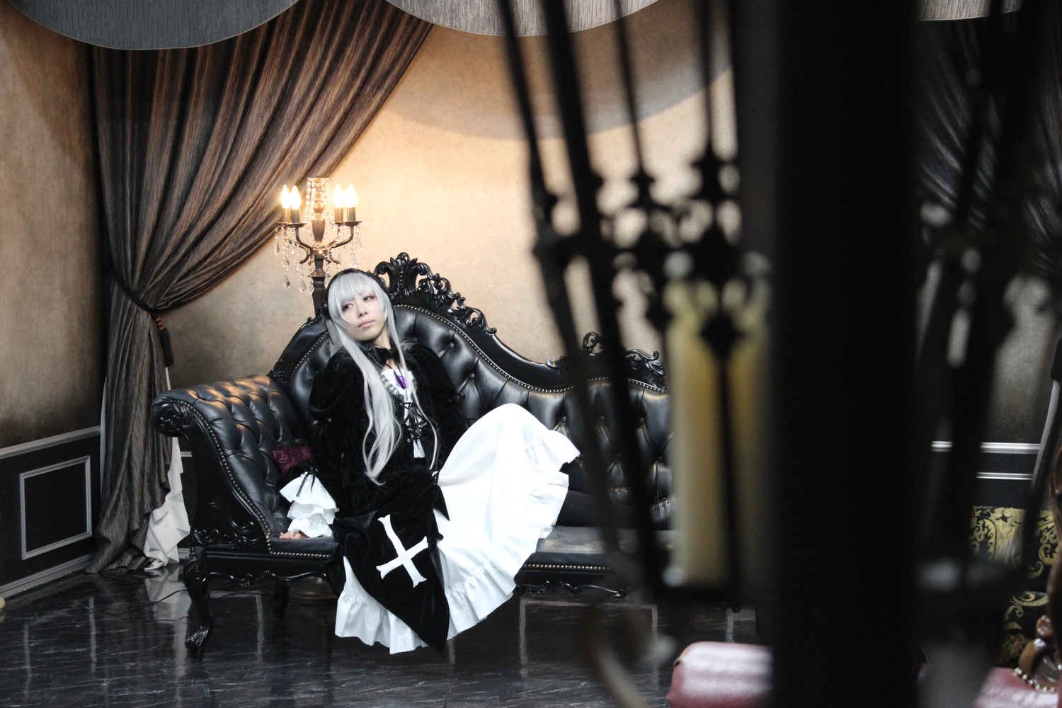 1girl blurry curtains depth_of_field dress flower frills gothic_lolita indoors lolita_fashion long_hair long_sleeves rose silver_hair sitting solo suigintou very_long_hair window