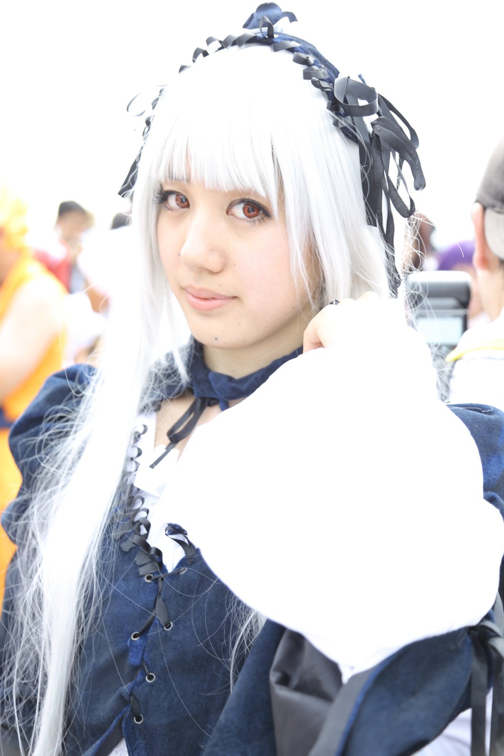 1girl 3d bangs blurry blurry_background blurry_foreground choker depth_of_field hairband lips looking_at_viewer photo red_eyes solo suigintou white_hair