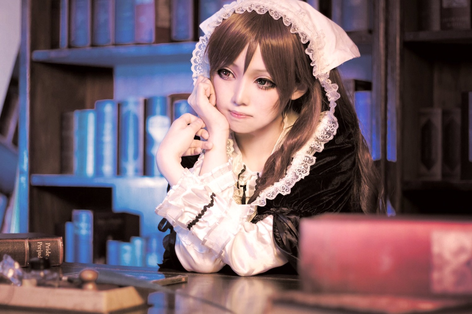 1girl 3d blurry blurry_background blurry_foreground book book_stack bookshelf brown_eyes brown_hair depth_of_field indoors library lips looking_at_viewer sitting solo suiseiseki