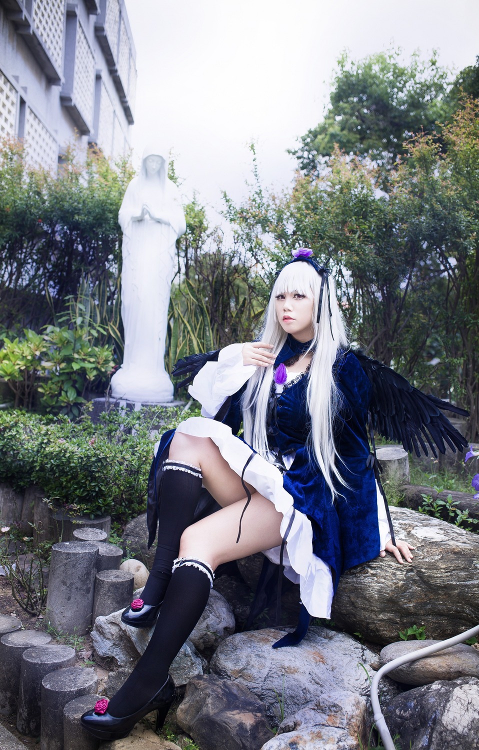 1girl black_legwear crossed_legs dress kneehighs long_hair sitting solo suigintou tree white_hair wings