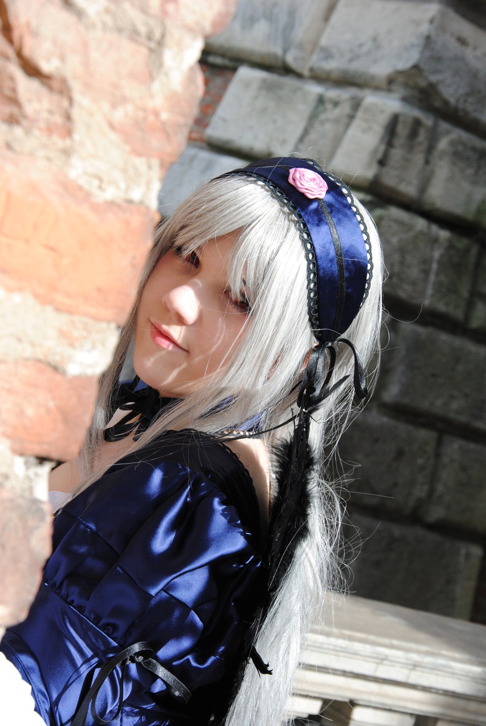 1girl 3d auto_tagged blurry blurry_background blurry_foreground closed_eyes closed_mouth depth_of_field hairband jewelry lips photo photorealistic solo suigintou