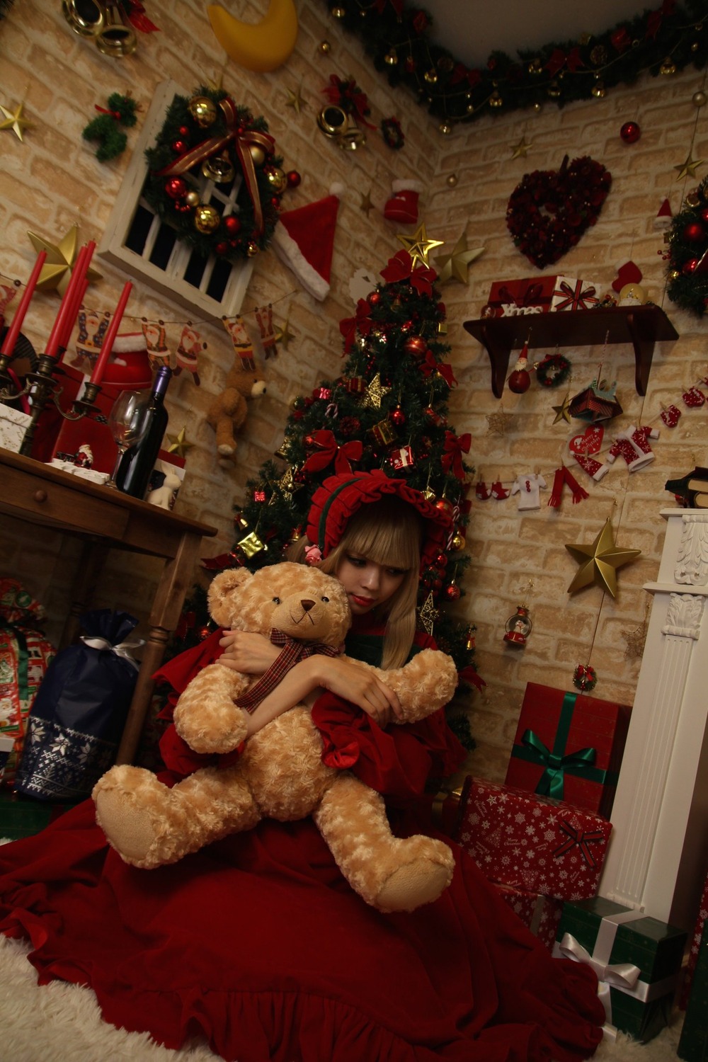 1girl blonde_hair box butterfly christmas christmas_ornaments christmas_tree dress fireplace gift gift_box insect merry_christmas shinku sitting solo star_(symbol) stuffed_animal teddy_bear