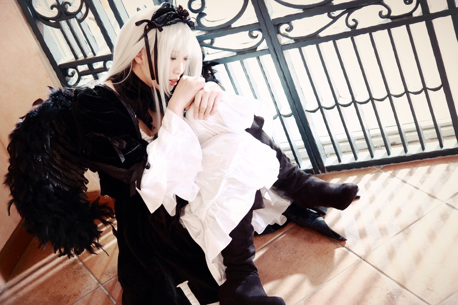 1boy 1girl black_dress cat closed_eyes crow dress flower indoors long_hair sitting solo suigintou tile_floor white_hair
