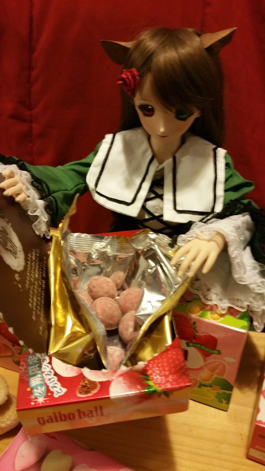1girl animal_ears brown_hair cat_ears chopsticks doll flower food hair_flower hair_ornament long_hair long_sleeves solo suiseiseki