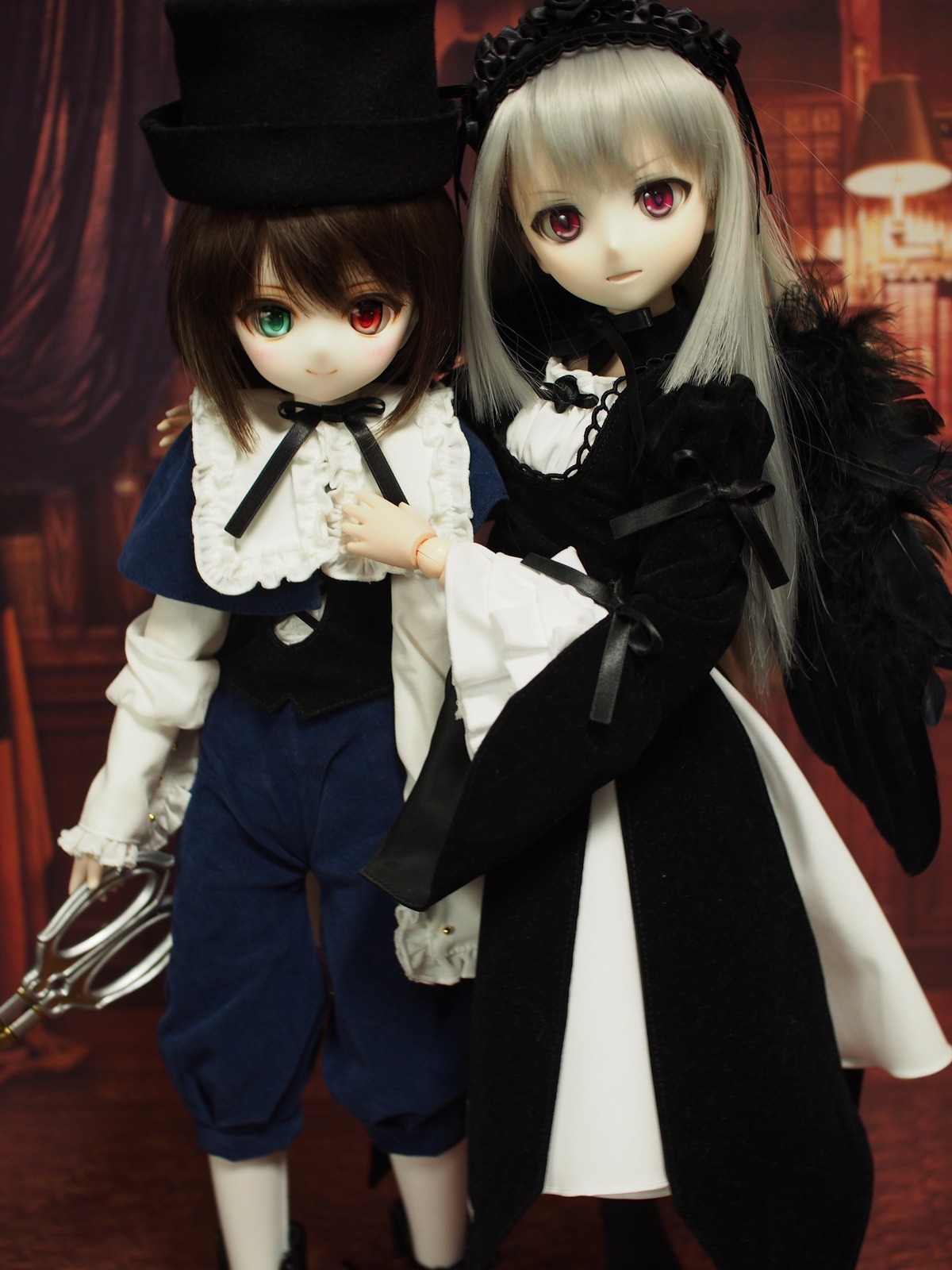 2girls doll dress frills hairband hat heterochromia long_hair long_sleeves looking_at_viewer multiple_dolls multiple_girls red_eyes ribbon short_hair smile souseiseki suigintou tagme
