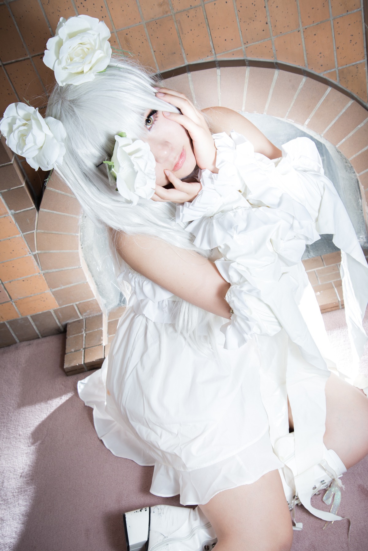 1girl bare_shoulders brick_wall dress eyepatch flower hair_flower hair_ornament hands_on_own_face kirakishou lips looking_at_viewer rose sitting solo tile_floor tile_wall tiles white_dress white_flower white_hair white_rose