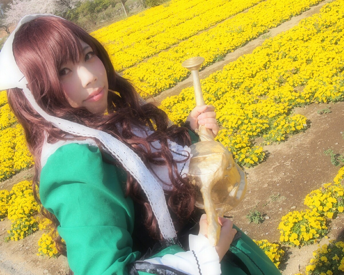 1girl brown_hair dandelion day field flower flower_field holding long_hair long_sleeves looking_at_viewer outdoors solo suiseiseki sunflower yellow_flower