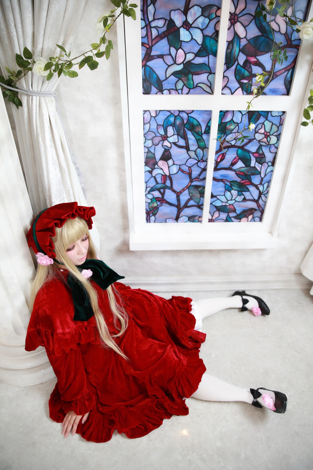 1girl blonde_hair bonnet bow dress flower long_hair long_sleeves red_dress shinku sitting solo white_legwear window