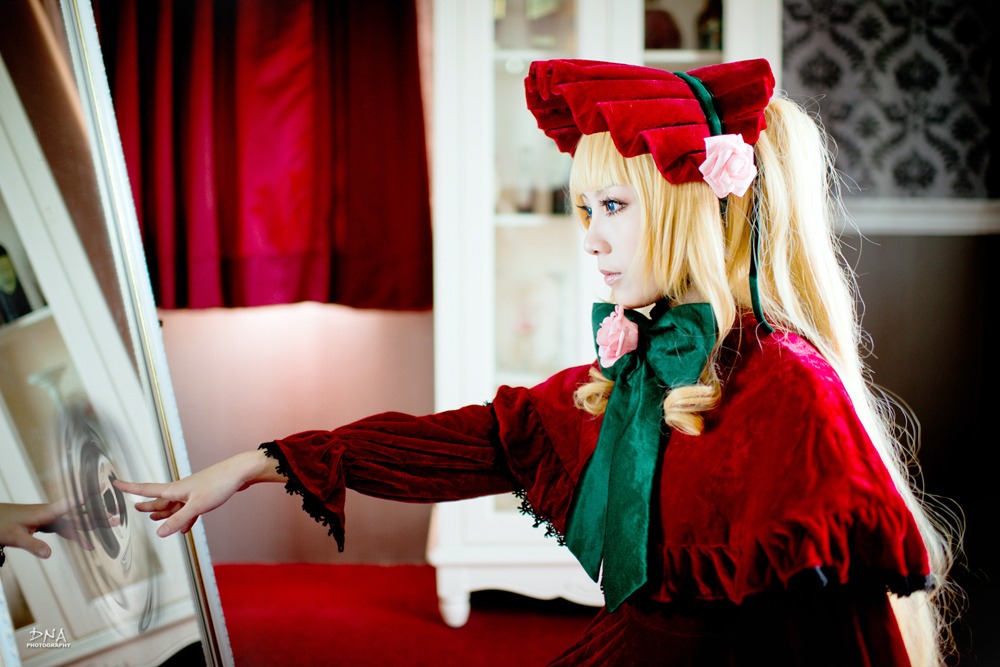 1girl blonde_hair blue_eyes blurry bonnet cup curtains depth_of_field dress figure flower long_hair long_sleeves photo red_dress shinku solo teacup