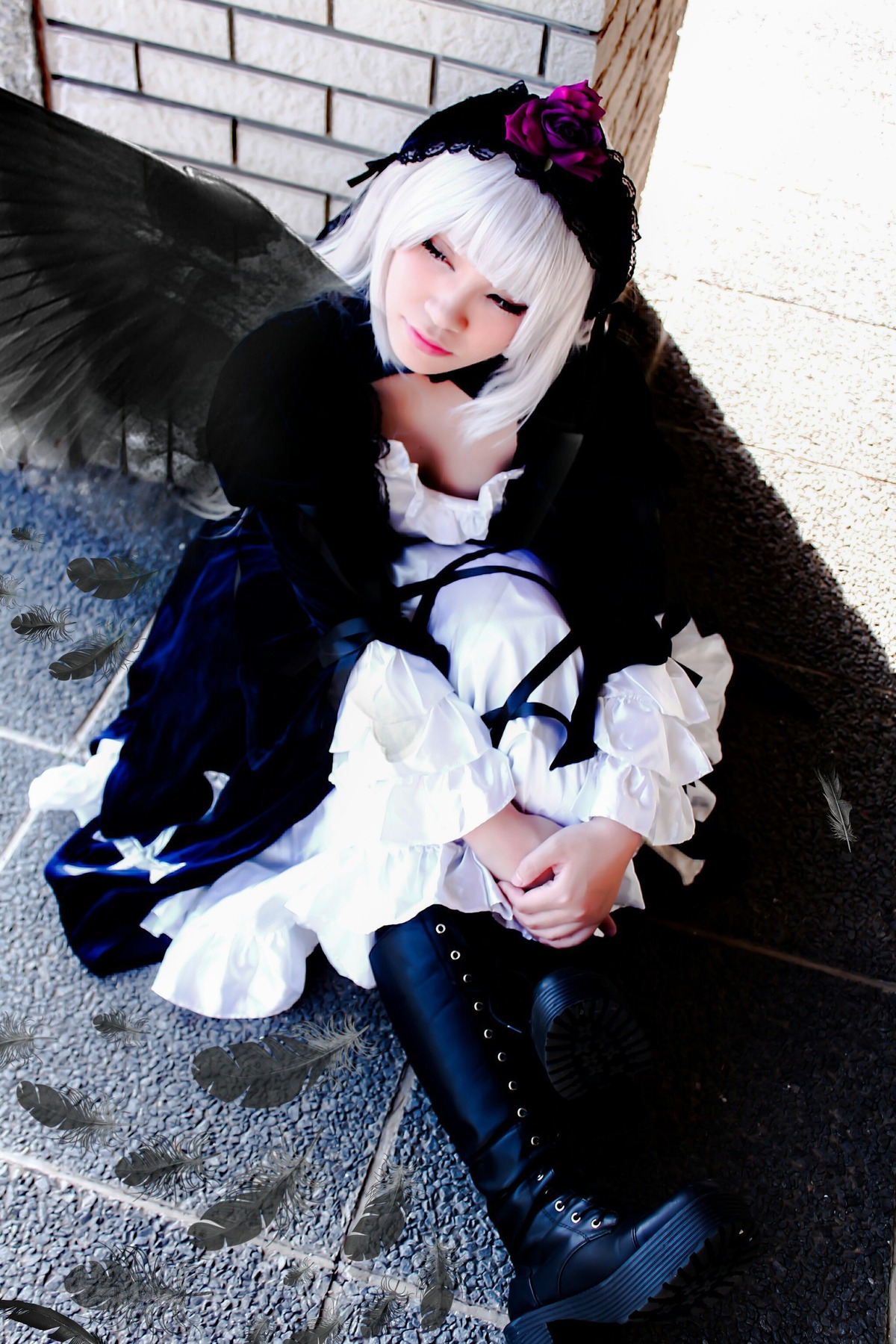 1girl black_dress black_wings closed_eyes dress feathers flower frills gothic_lolita hairband lolita_fashion long_hair long_sleeves sitting solo suigintou wings