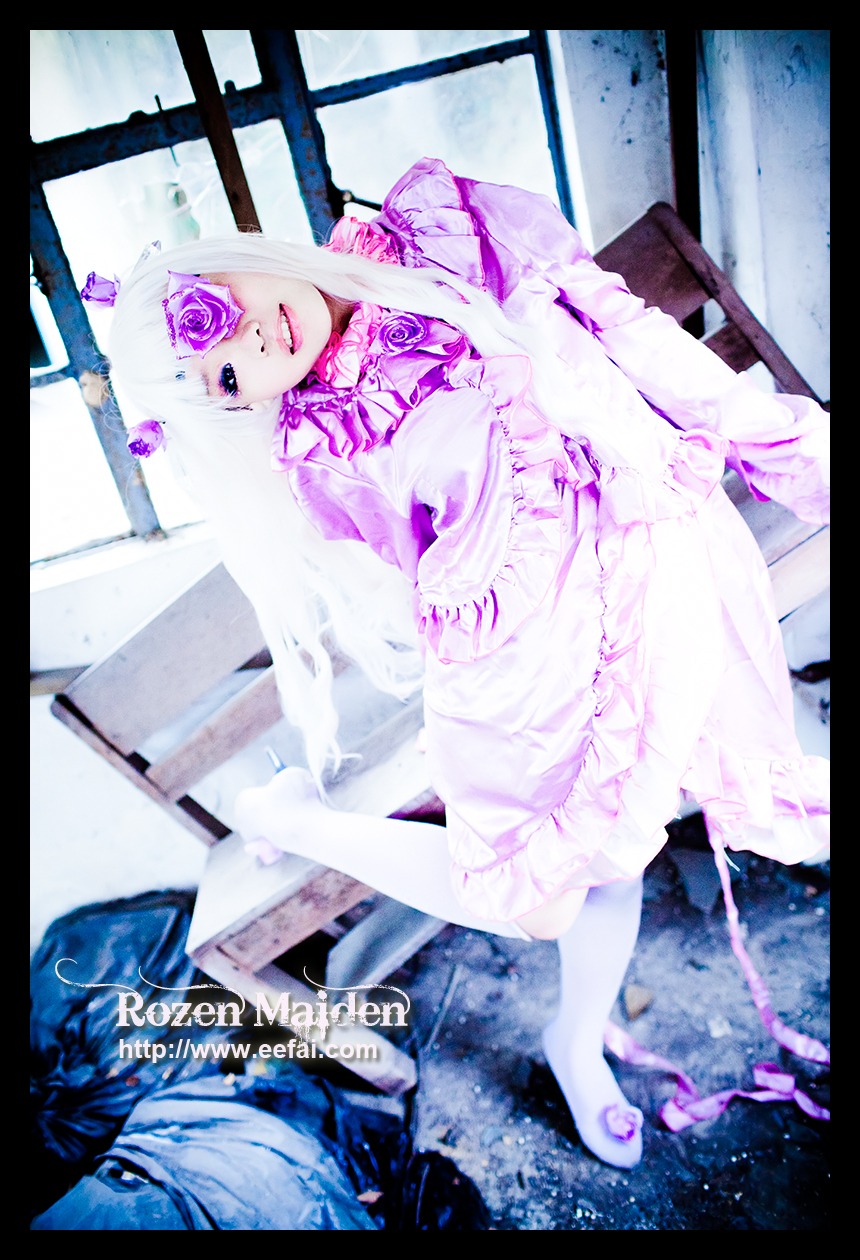 1girl barasuishou black_border dress eyepatch flower frills hair_ornament letterboxed lolita_fashion long_hair pillarboxed purple_eyes rose sitting solo white_hair