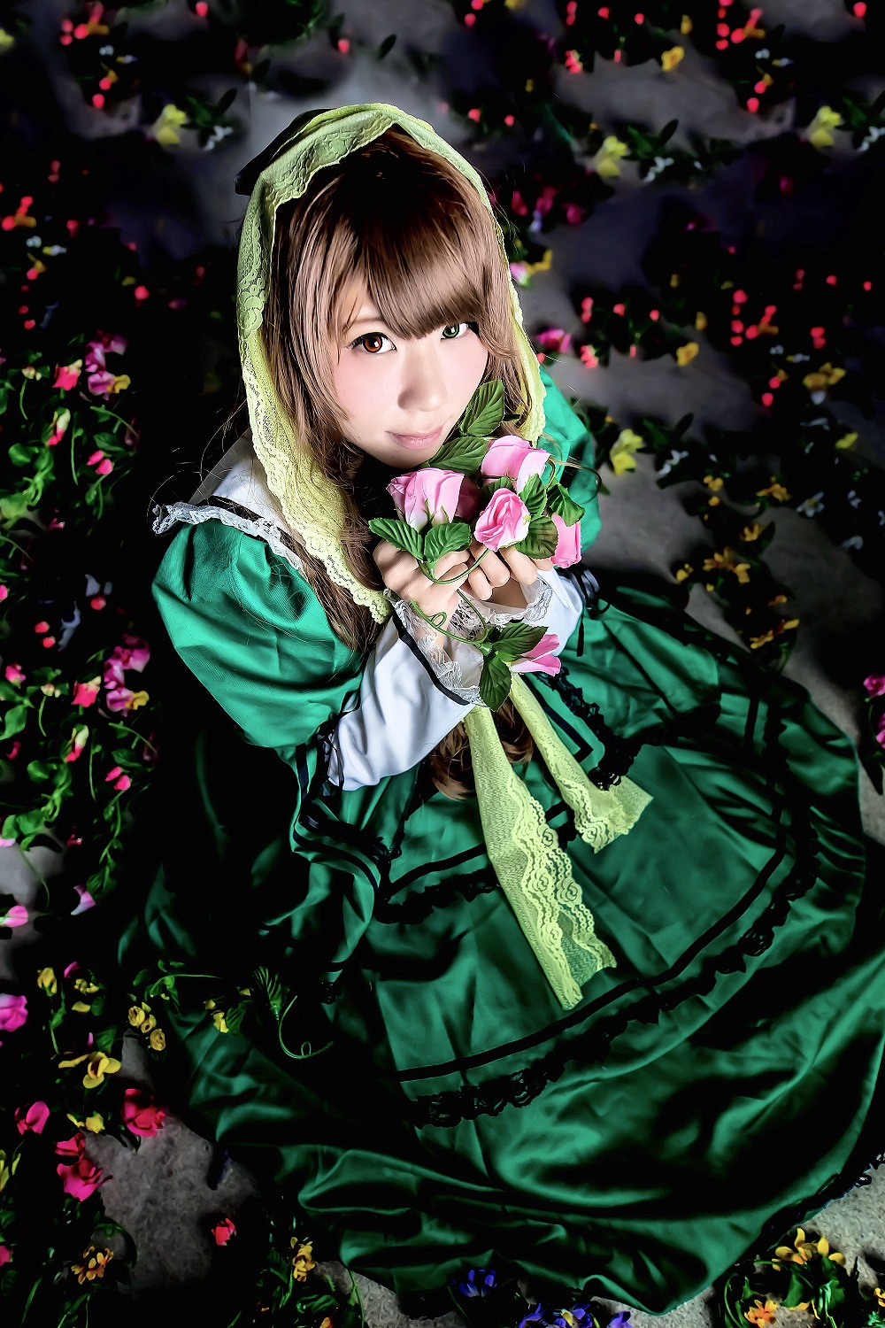 1girl brown_hair dress flower green_dress green_eyes heterochromia holding long_sleeves looking_at_viewer solo suiseiseki