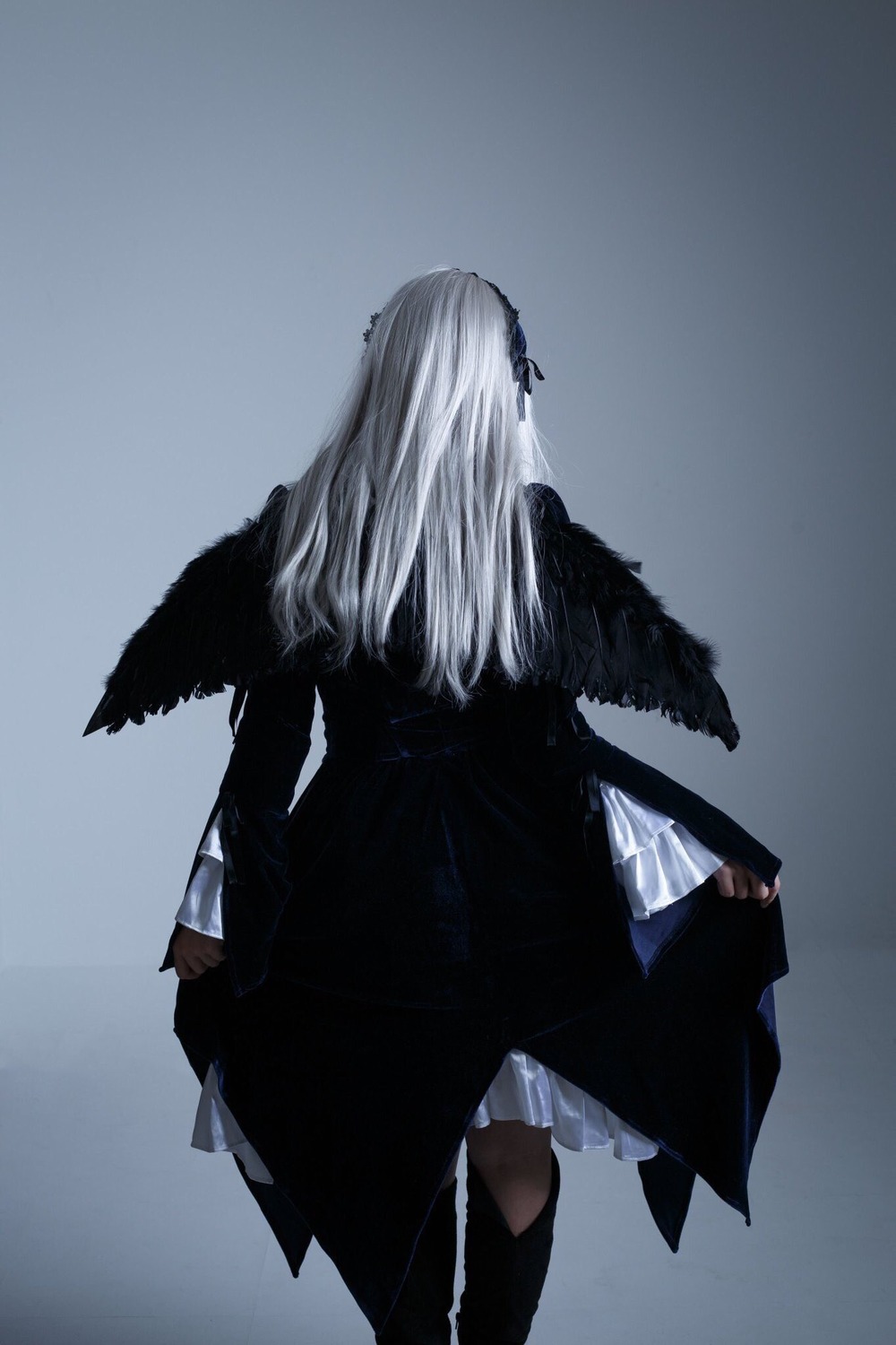 1girl black_dress black_legwear black_ribbon black_wings dress facing_away gradient gradient_background grey_background hairband long_hair long_sleeves ribbon solo standing suigintou wide_sleeves wings