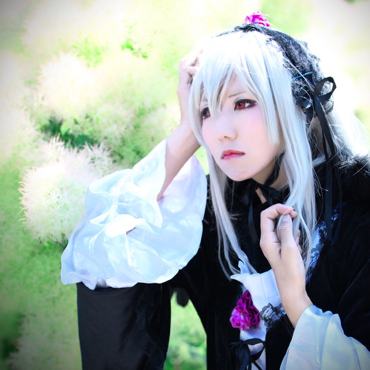 1girl black_dress closed_mouth doll_joints dress flower hairband lips long_hair long_sleeves red_eyes solo suigintou upper_body