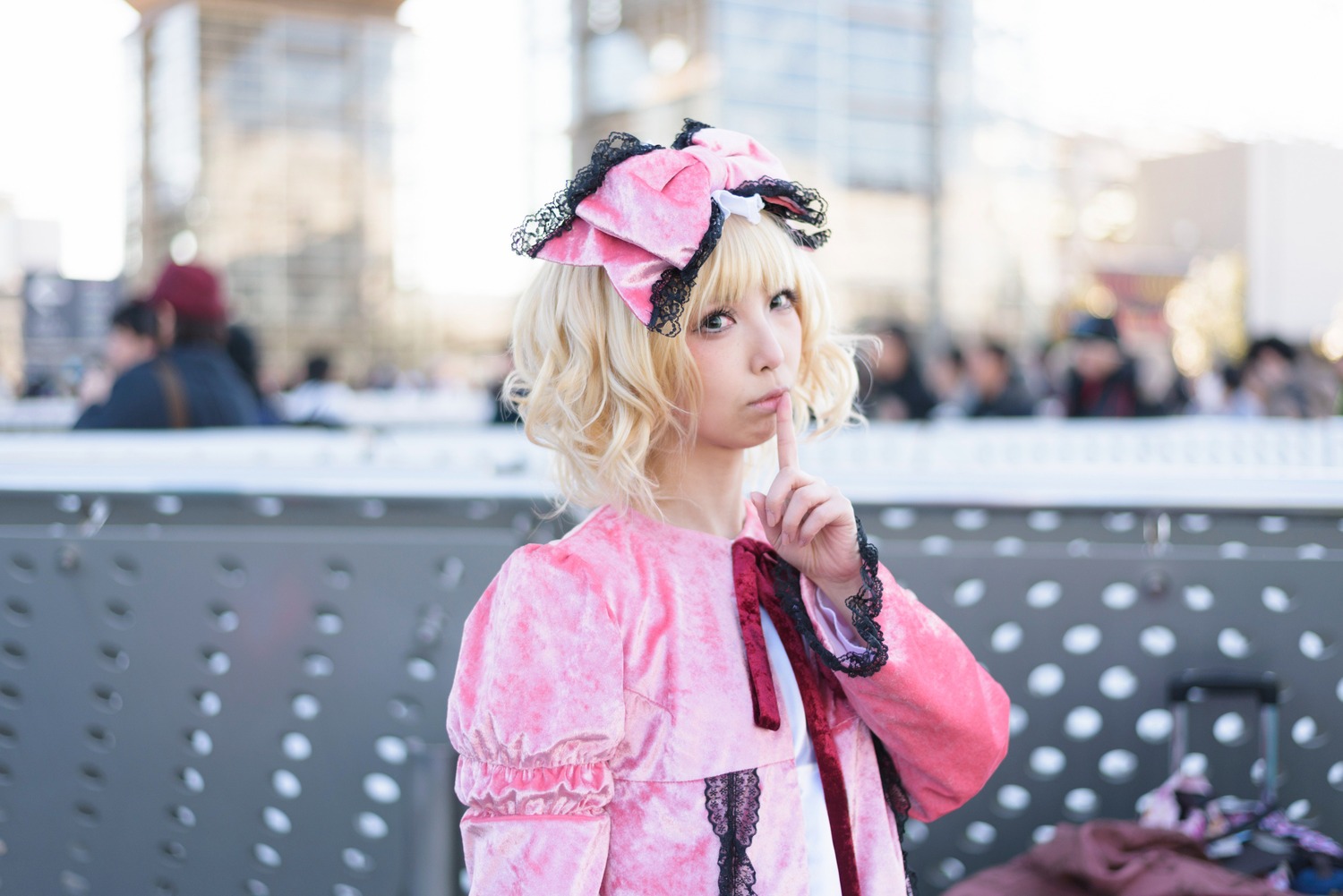 1girl 3d blonde_hair blurry blurry_background blurry_foreground building city day depth_of_field dress hinaichigo lips long_sleeves looking_at_viewer outdoors photo photo_background realistic ribbon short_hair solo solo_focus upper_body