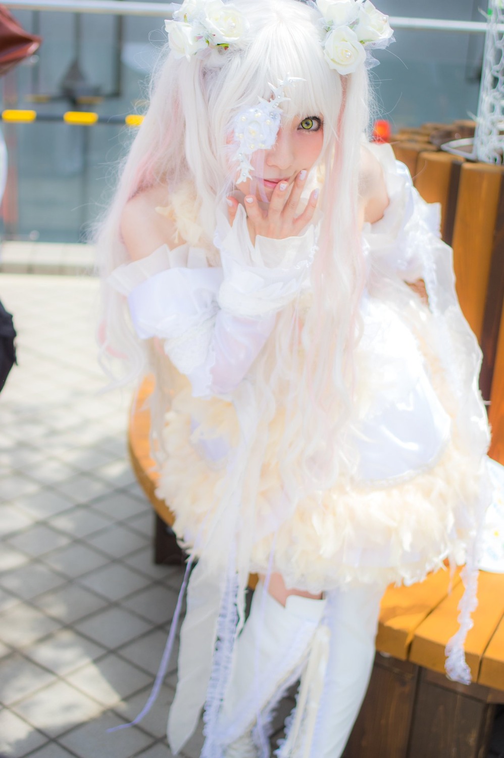1girl bandages blurry blurry_background blurry_foreground depth_of_field dress flower green_eyes hair_ornament kirakishou long_hair sitting solo white_hair