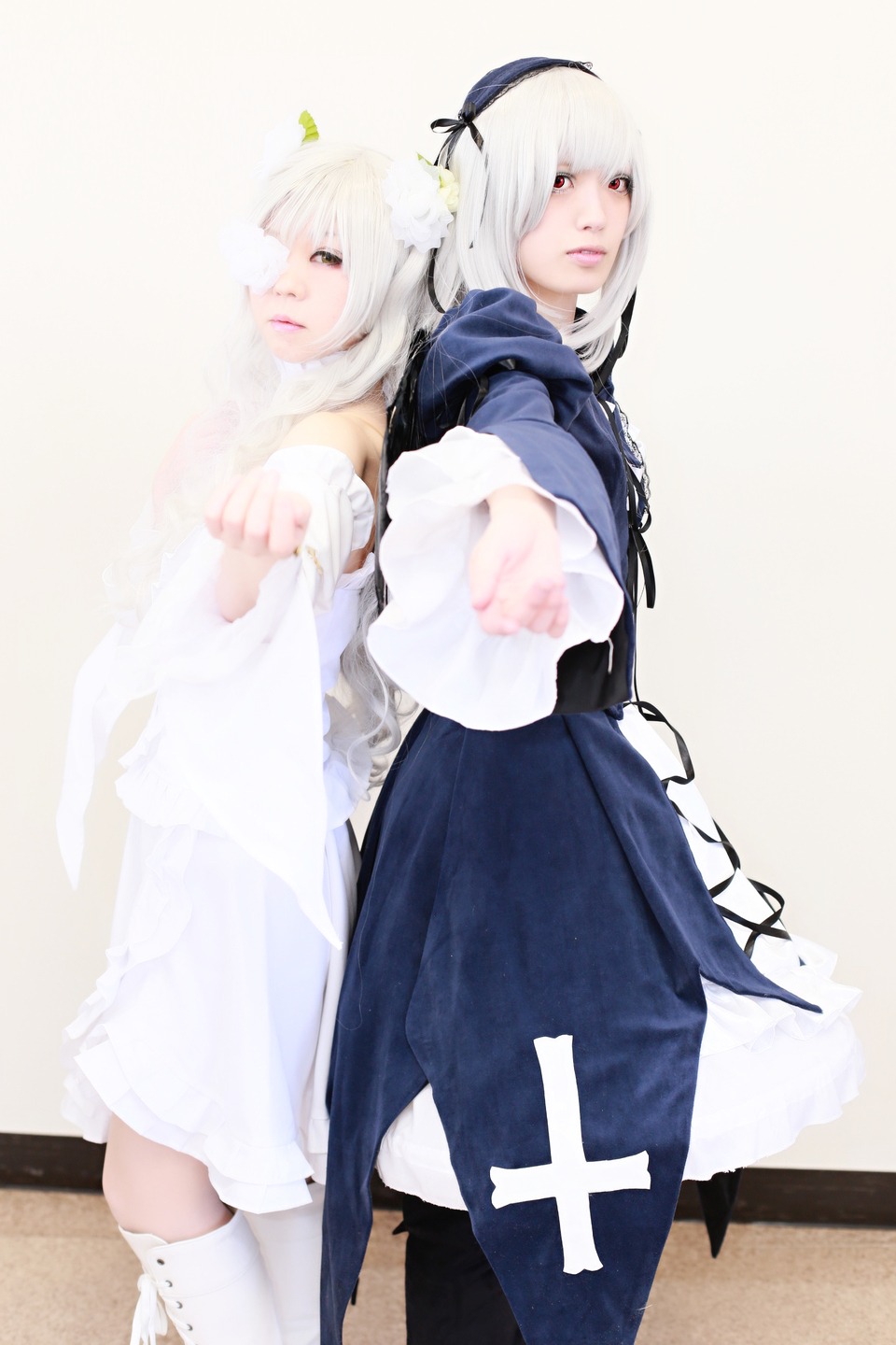 2girls 3d blurry blurry_foreground depth_of_field dress foreshortening hairband long_hair looking_at_viewer multiple_cosplay multiple_girls photo red_eyes siblings suigintou tagme vertical_stripes white_hair