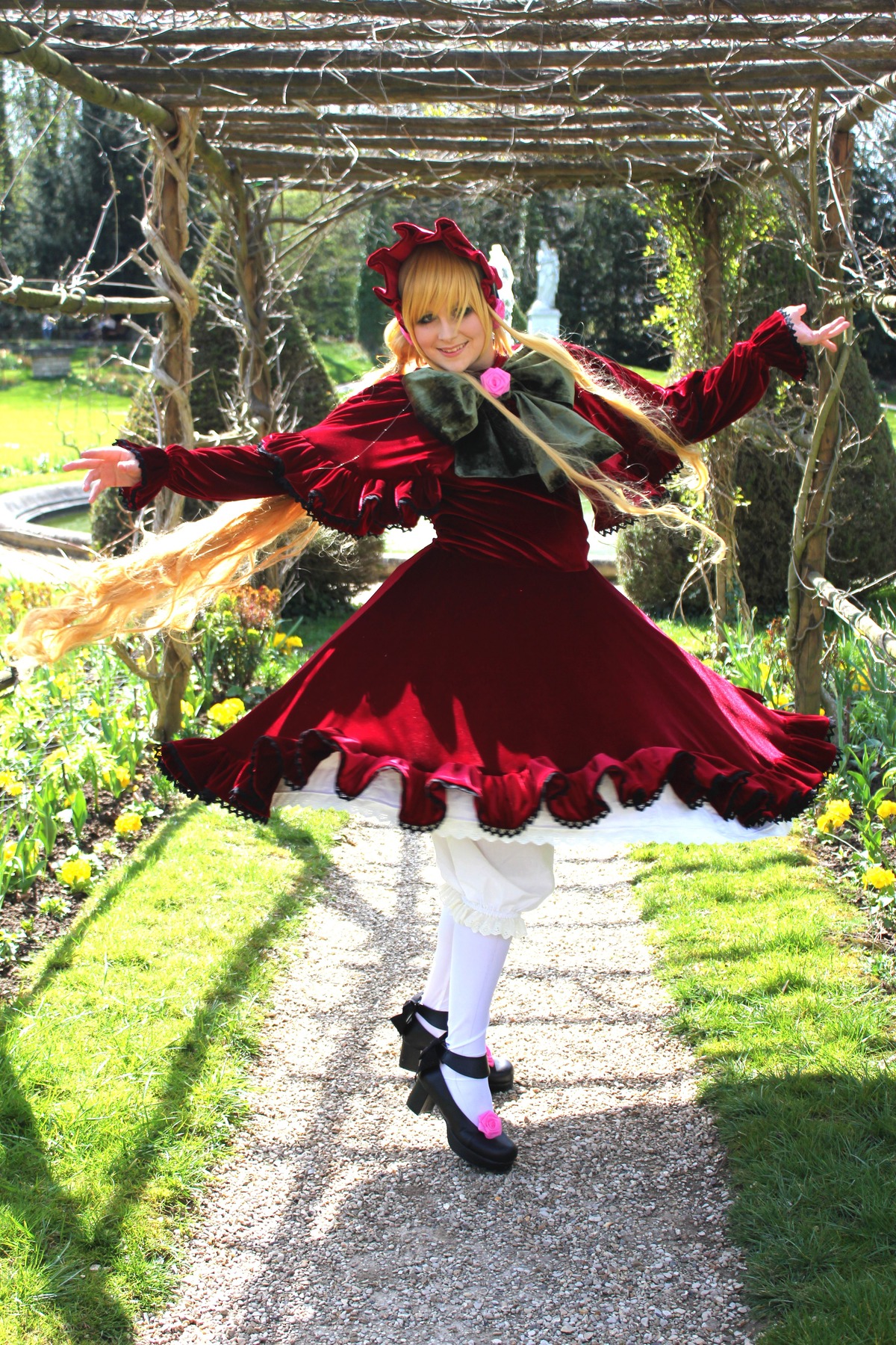 1girl blonde_hair bow dress flower forest grass long_sleeves nature outdoors outstretched_arms red_dress shinku shoes solo spread_arms tree white_legwear