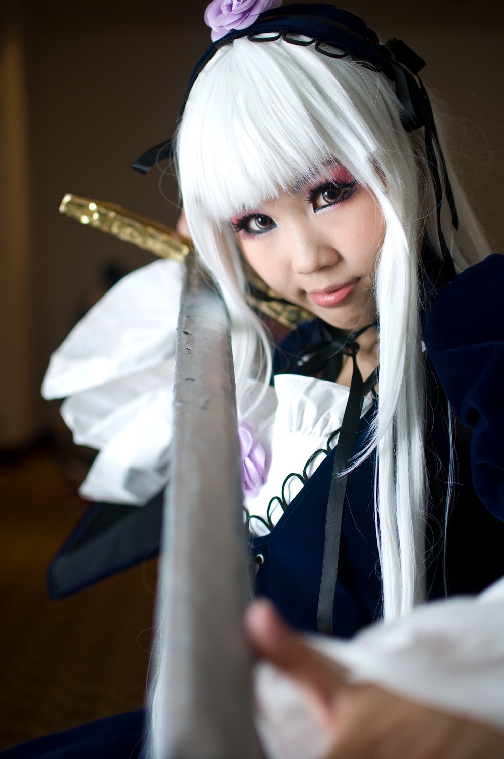 1girl bangs blurry blurry_foreground depth_of_field flower hairband lips looking_at_viewer photo rose solo suigintou white_hair