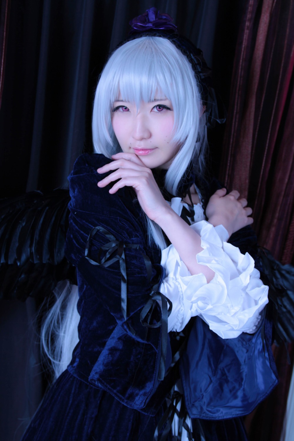 1girl bangs closed_mouth dress frills gothic_lolita indoors lips lolita_fashion long_sleeves looking_at_viewer own_hands_together realistic solo suigintou