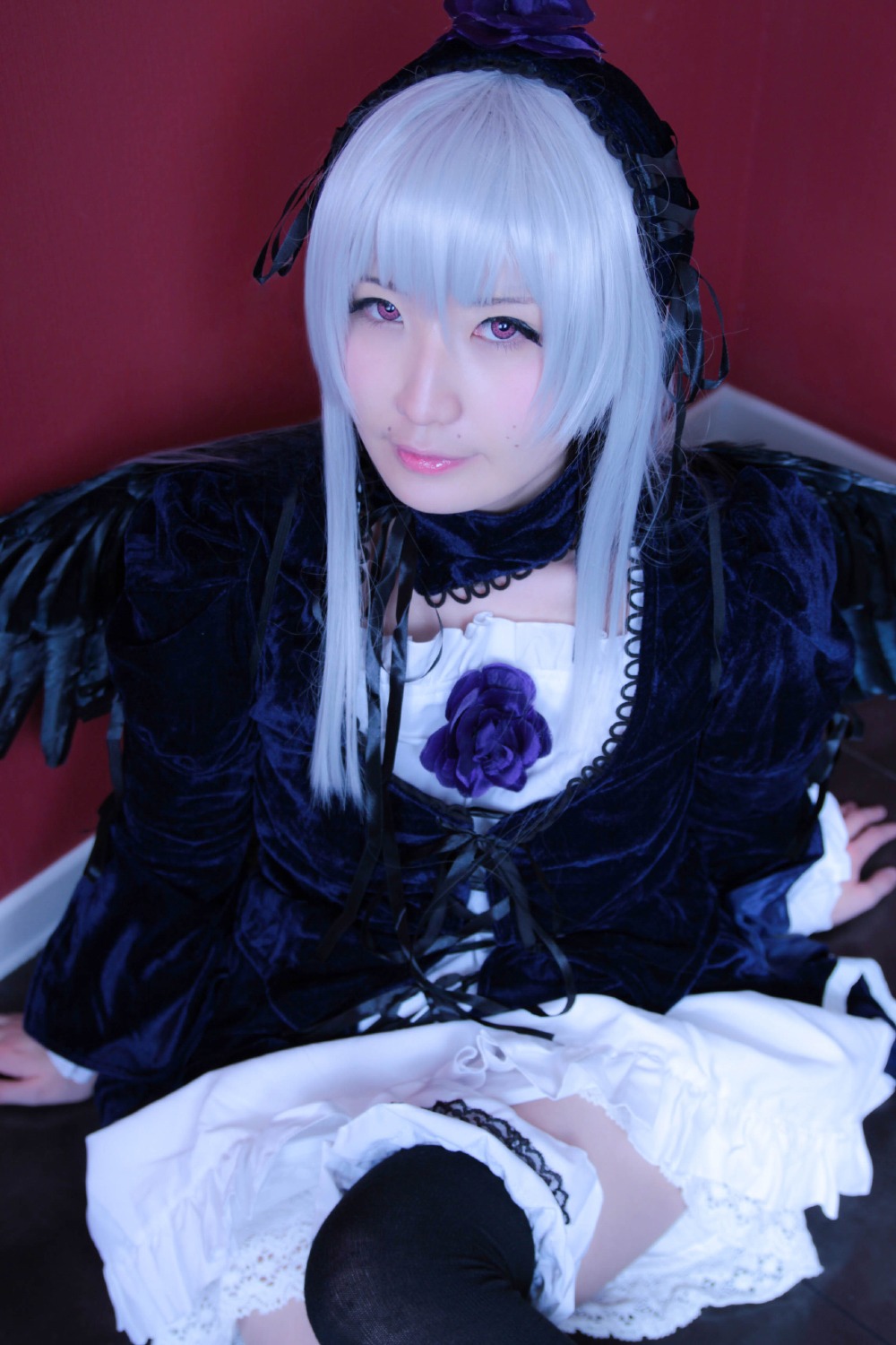 1girl bangs black_legwear closed_mouth dress frills gothic_lolita lips lolita_fashion long_hair long_sleeves looking_at_viewer rose sitting solo suigintou thighhighs