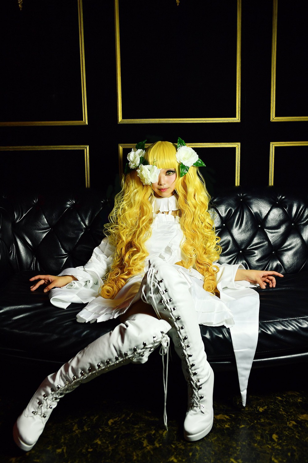 1girl blonde_hair boots cross-laced_footwear dress flower full_body hair_flower hair_ornament kirakishou lace-up_boots long_hair sitting solo white_dress white_flower white_footwear