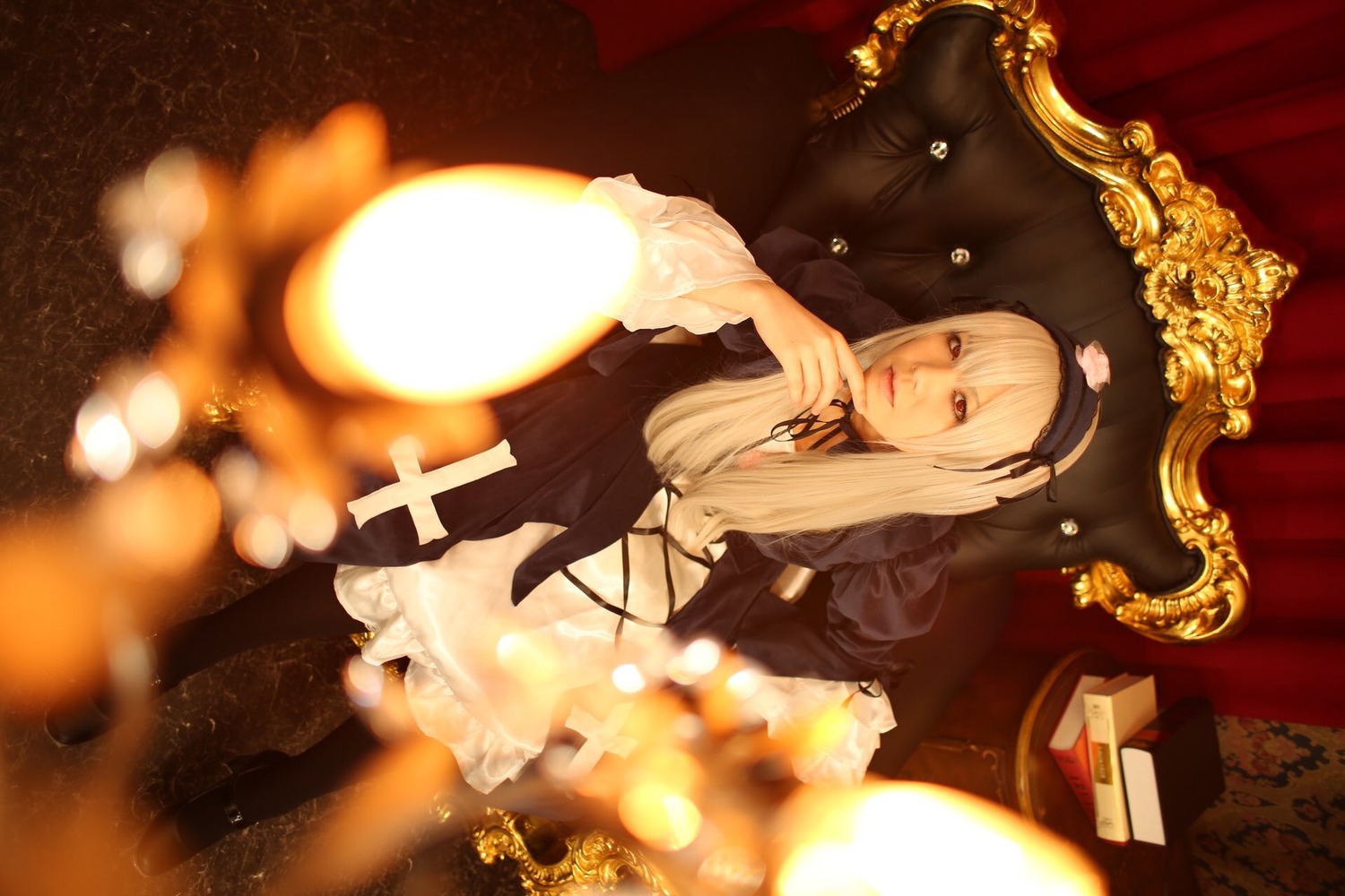 1girl blonde_hair blurry candle candlestand curtains depth_of_field dress fire indoors long_hair long_sleeves solo suiseiseki