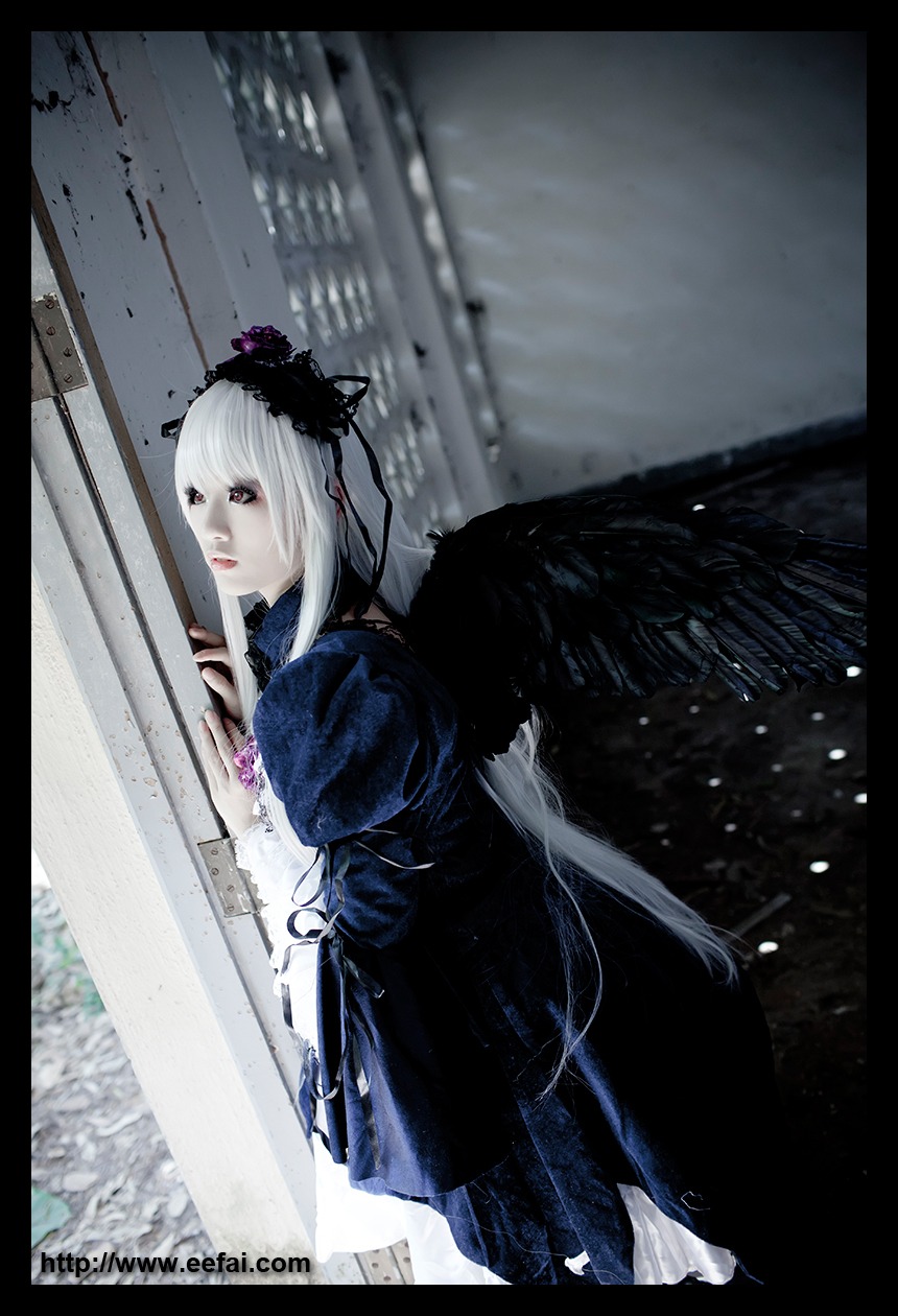 1girl black_border black_wings dress feathers frills letterboxed long_hair long_sleeves looking_at_viewer pillarboxed silver_hair snow solo suigintou white_hair wings