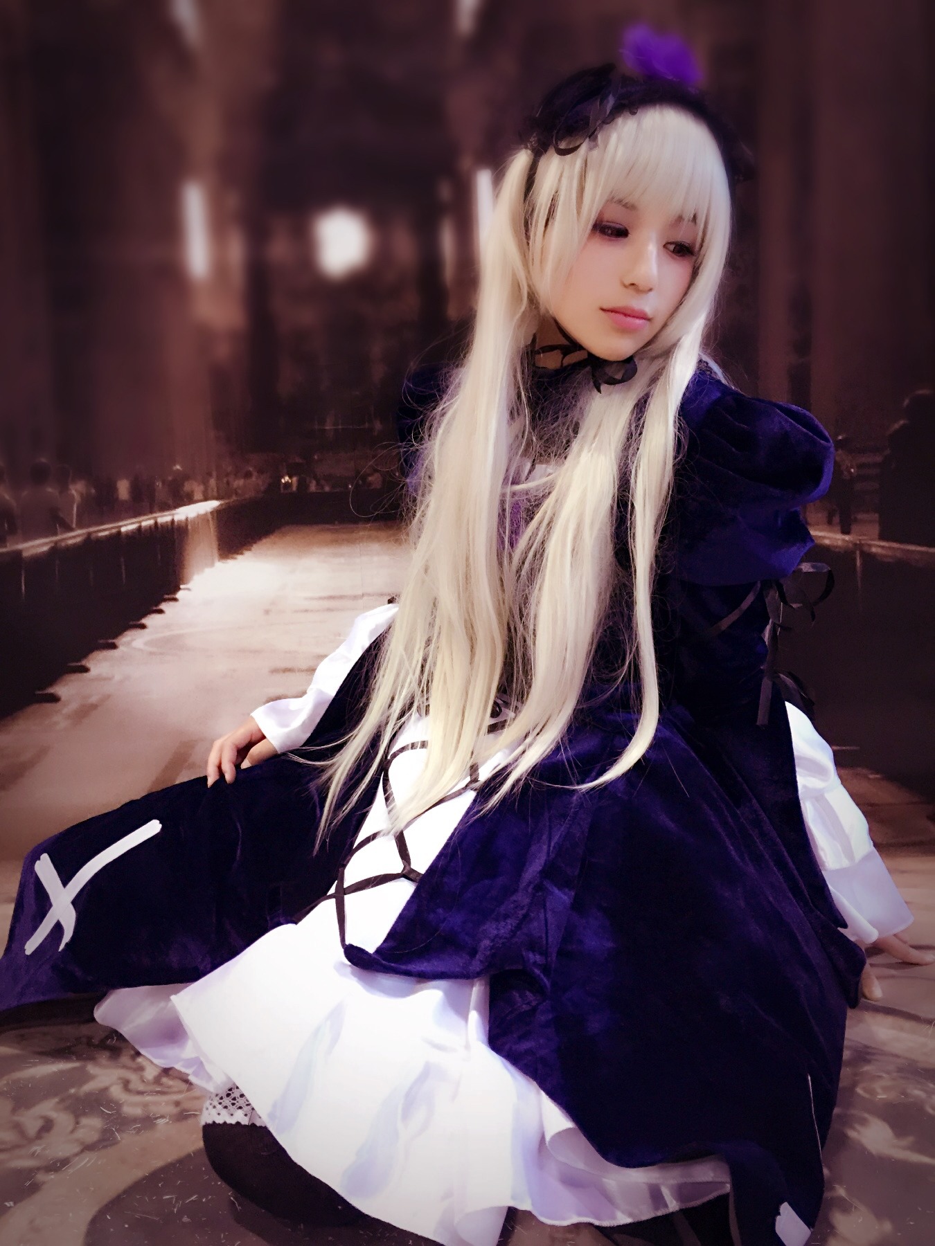 1girl bangs belarus_(hetalia) blonde_hair blurry closed_mouth dress lips long_hair long_sleeves looking_at_viewer realistic sitting solo suigintou