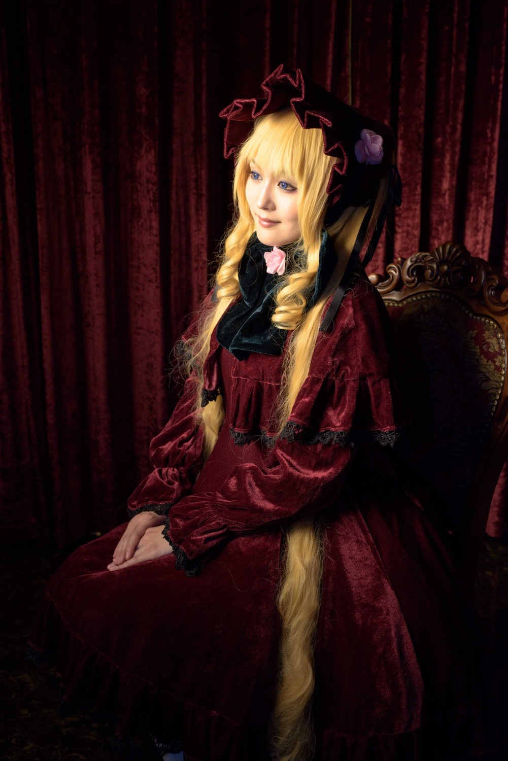 1girl blonde_hair blue_eyes curtains dress flower lips long_hair long_sleeves red_dress rose shinku sitting solo